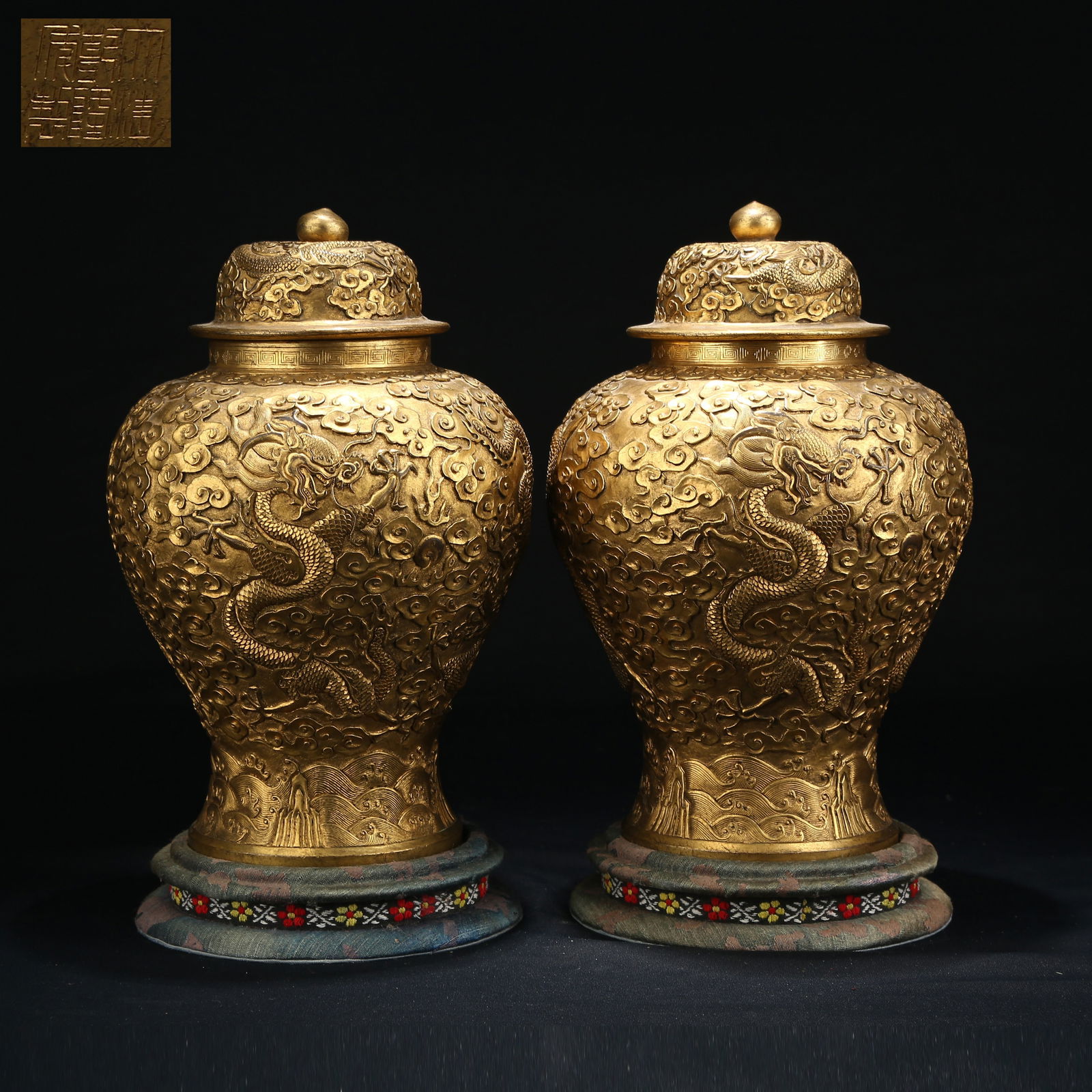 A GILT BRONZE SET OF COVERED JARS WITH CLOUD AND DRAGON PATTERN: Gilt Bronze Set of Covered Jars with Cloud and Dragon Pattern