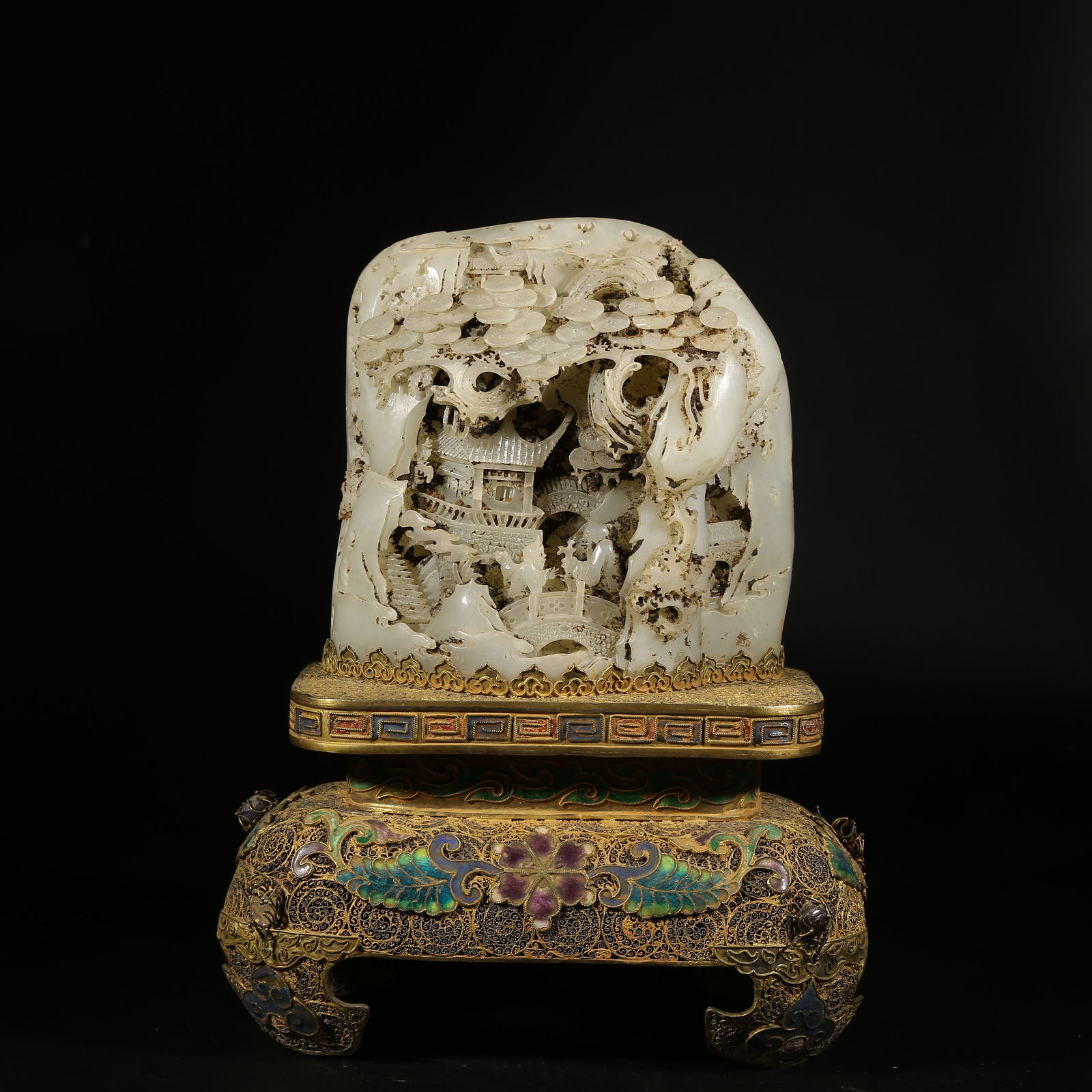 A HETIAN JADE LANDSCAPE WITH FIGURES MOUNTAIN ORNAMENT WITH GILT SILVER FILIGREE BASE: Hetian Jade Landscape with Figures Mountain Ornament with Gilt Silver Filigree Base