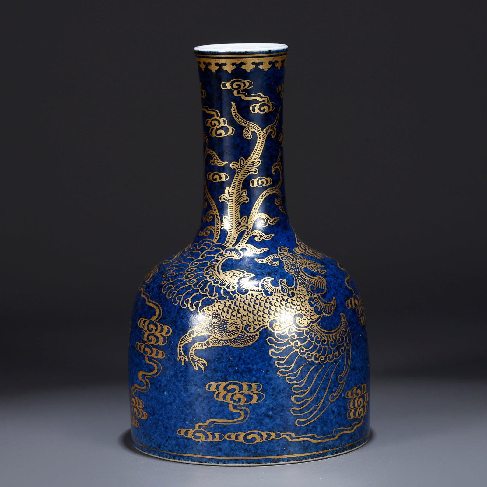 A BLUE GLAZE GILT DRAGON AND PHOENIX PATTERNED RATTLE VASE: Blue glaze gilt dragon and phoenix patterned rattle vase
