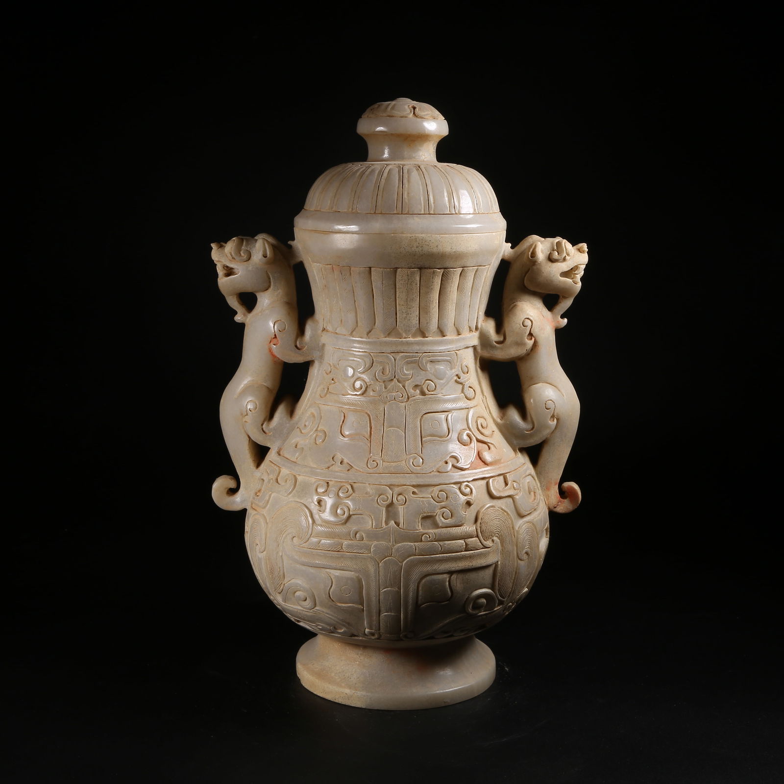 A ARCHAIC JADE LIDDED VASE WITH BEAST-FACE AND AUSPICIOUS BEAST MOTIFS (1 of 10)