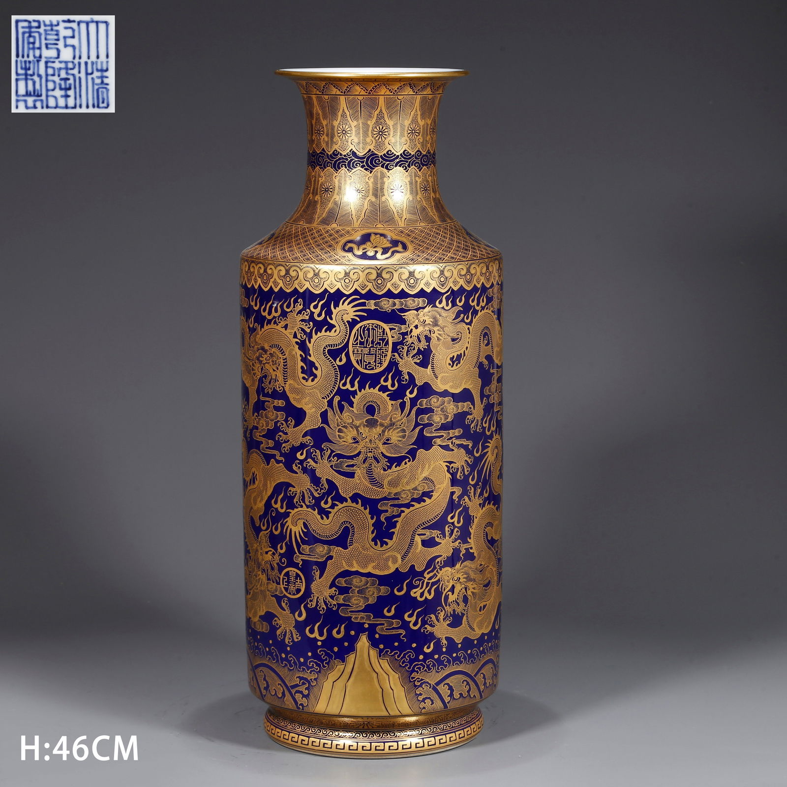 A BLUE GLAZED MALLET VASE WITH GILDED CLOUD AND DRAGON MOTIF: Blue glazed mallet vase with gilded cloud and dragon motif