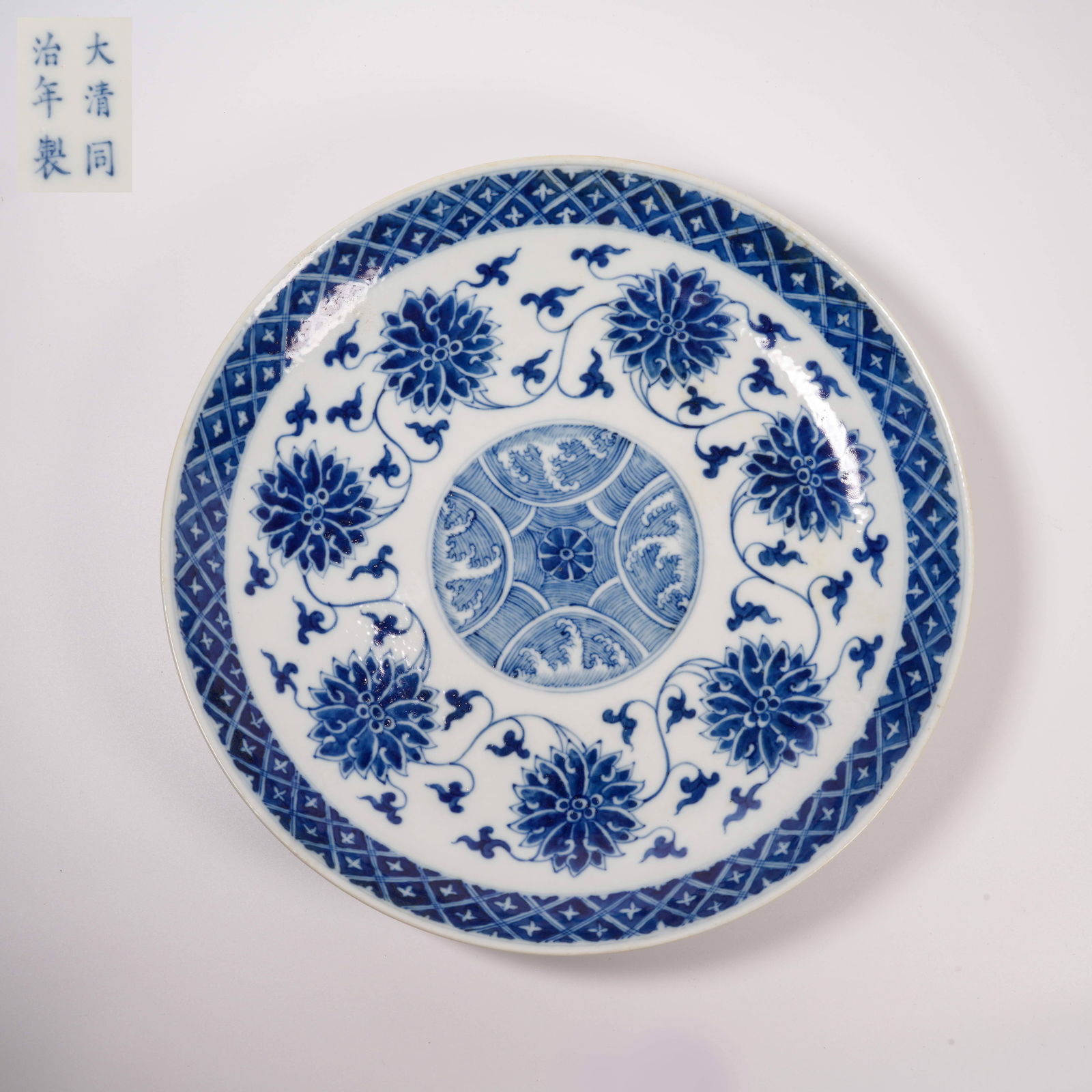 A BLUE-AND-WHITE PLATE WITH PASSIONFLOWER DESIGN: Blue-and-White Plate with Passionflower Design