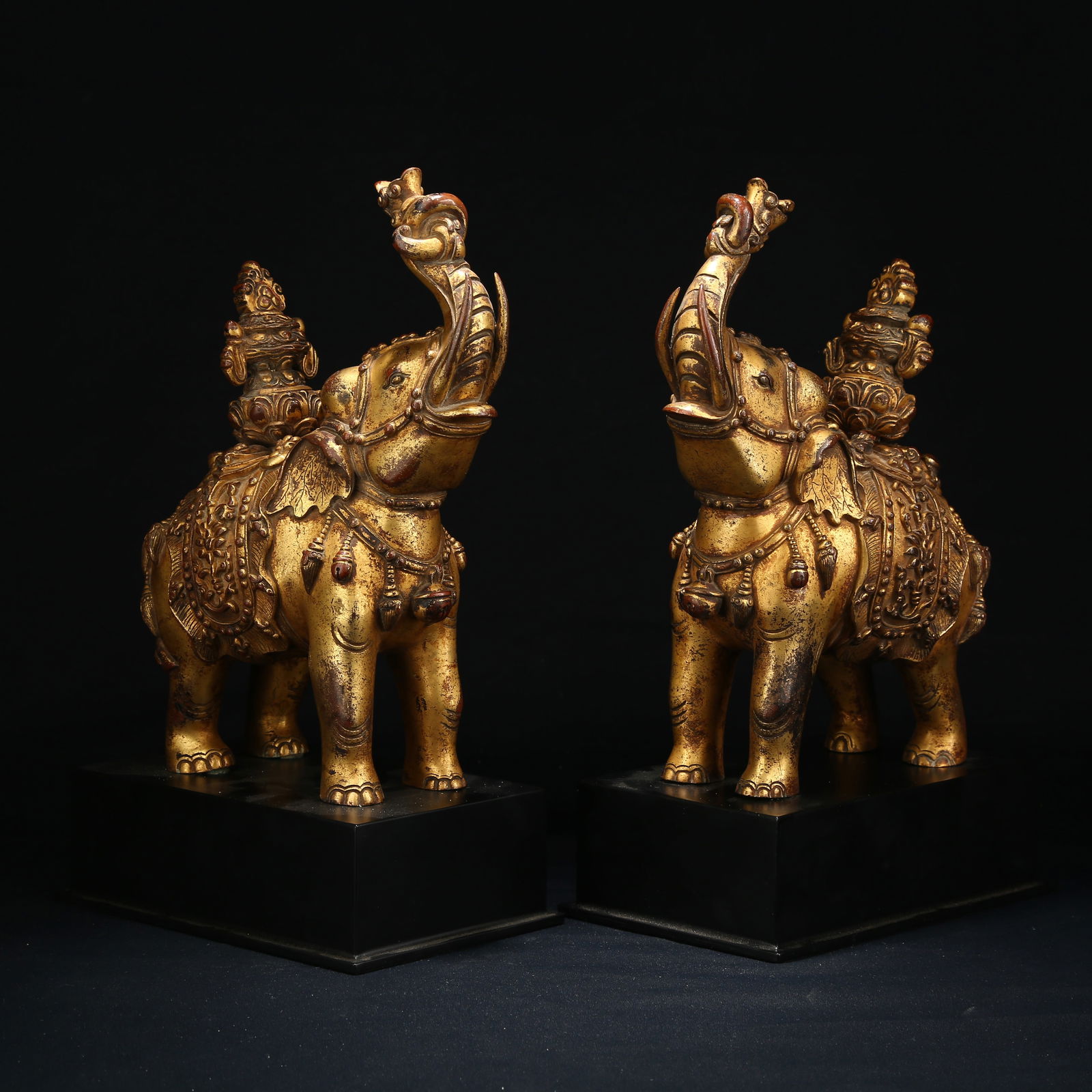 A GILT BRONZE SET OF PEACE AND PROSPERITY ELEPHANTS (1 of 14)