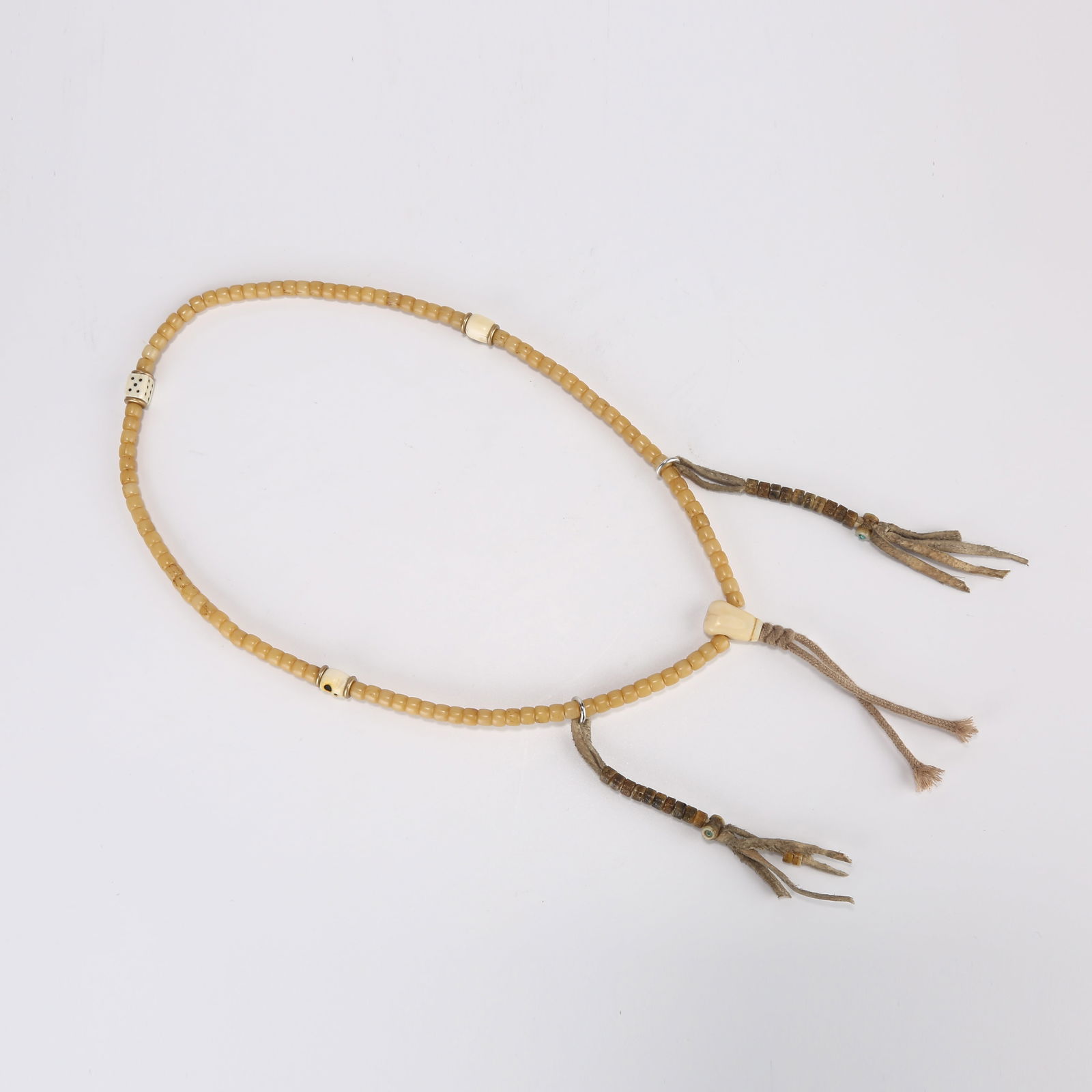 A STRAND OF BONE PRAYER BEADS: One strand of bone prayer beads