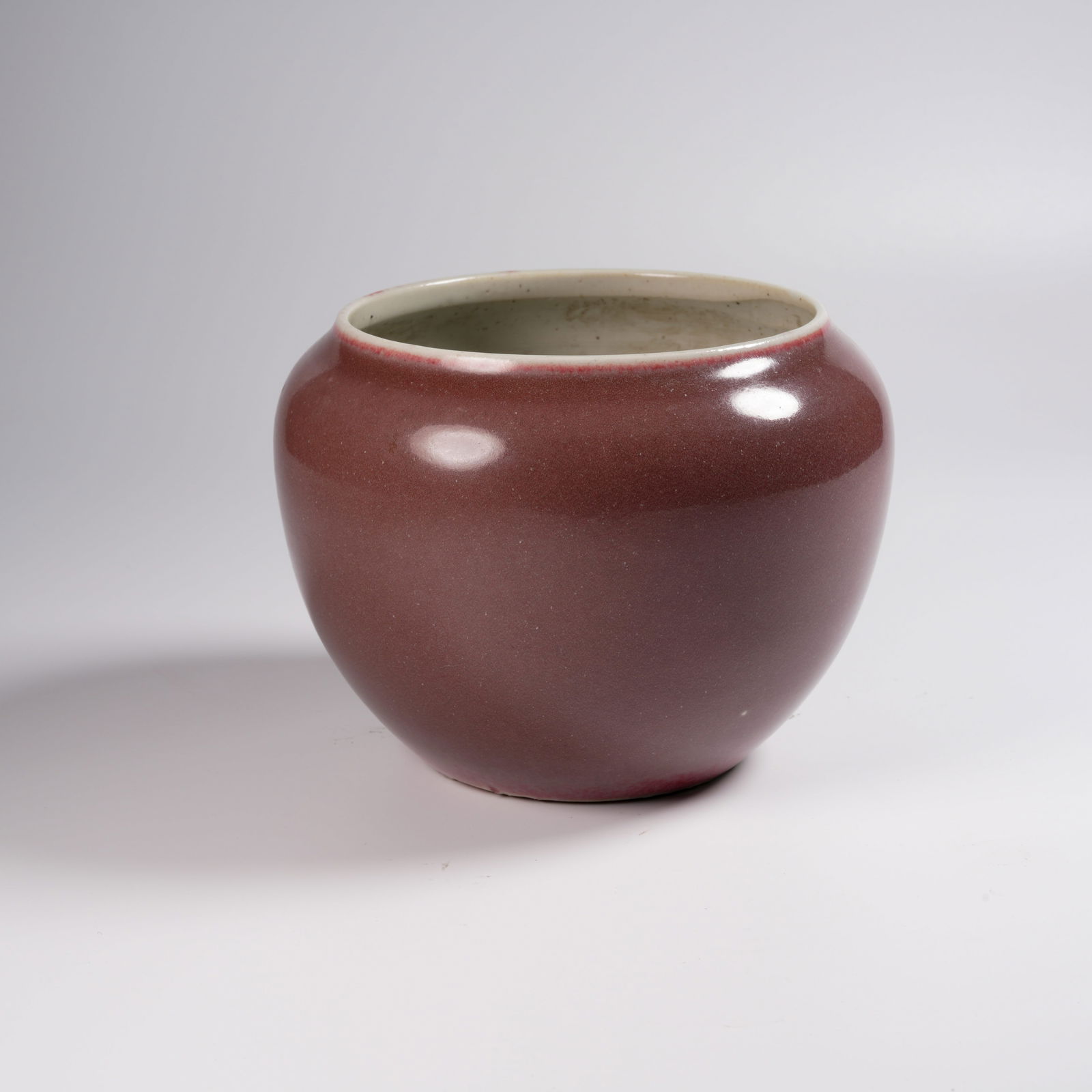 A PEA-RED–GLAZED APPLE-FORM VASE: Pea-Red–Glazed Apple-Form Vase