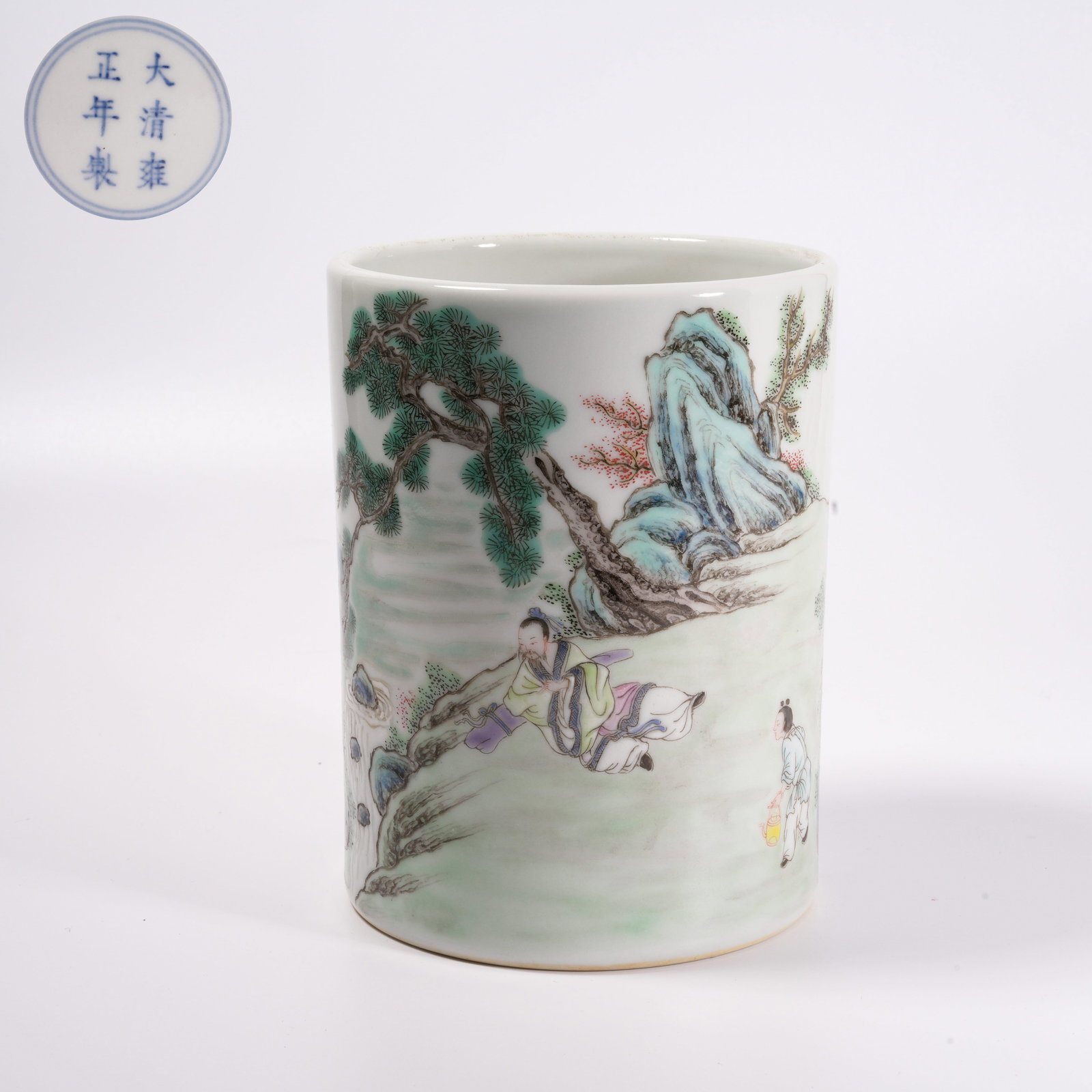 A FAMILLE-ROSE BRUSH HOLDER WITH "ELEGANT GATHERING BENEATH PINES" SCENE: Famille-Rose Brush Holder with "Elegant Gathering Beneath Pines" Scene