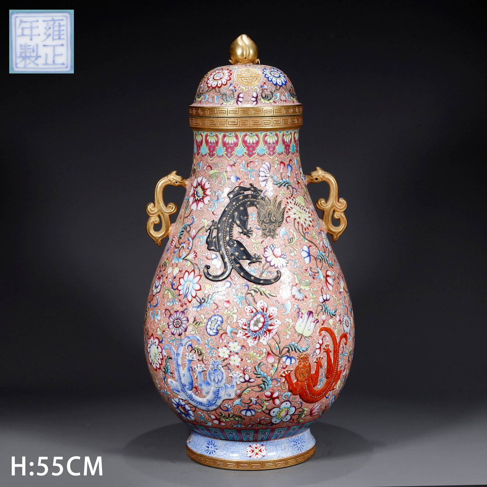 A FAMILLE ROSE COVERED JAR WITH "SHOU" LONGEVITY CHARACTER AND TWIN HANDLES: Famille rose covered jar with "shou" longevity character and twin handles