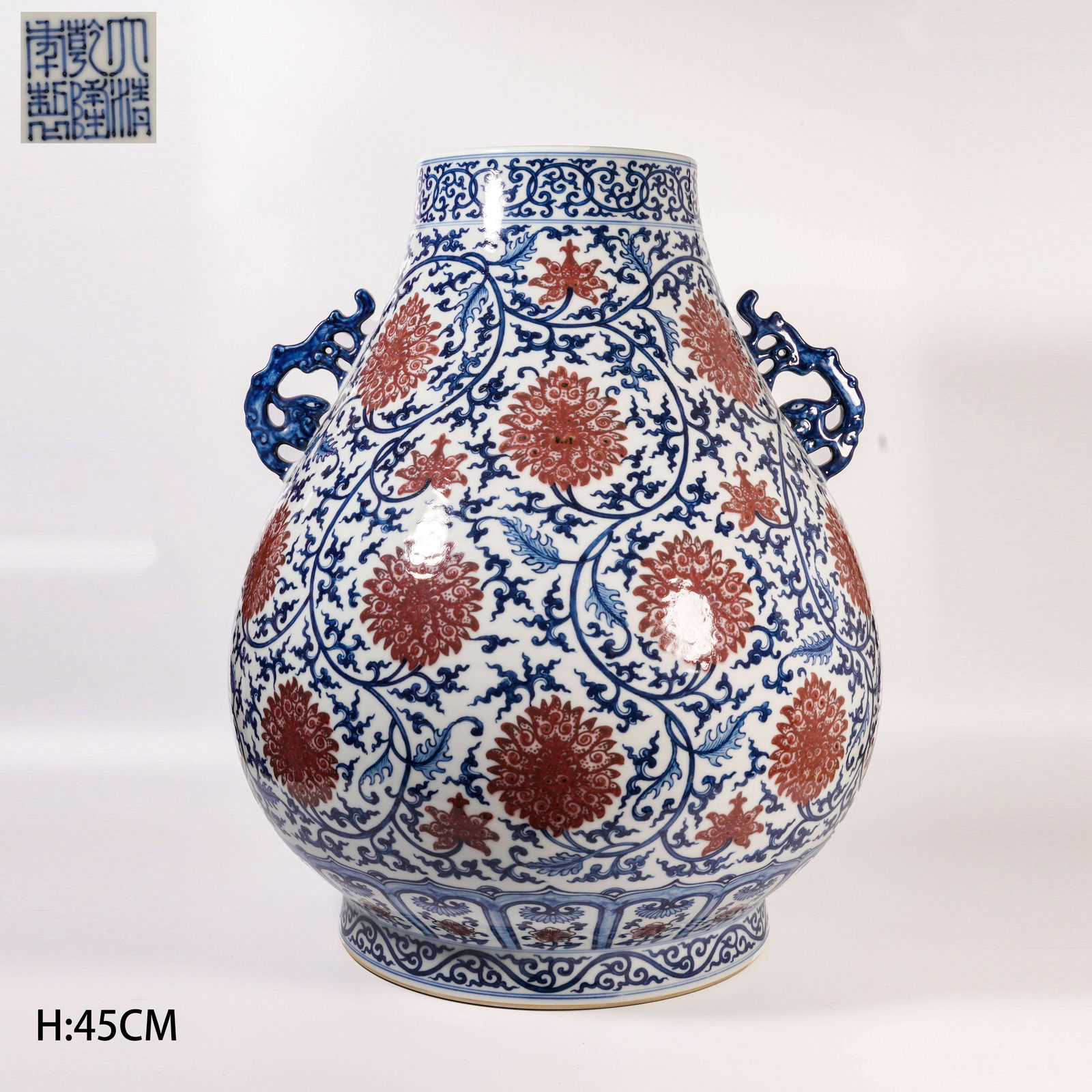 A BLUE-AND-WHITE AND IRON-RED DOUBLE-HANDLED ZUN WITH INTERTWINING PASSIONFLOWER DESIGN: Blue-and-White and Iron-Red Double-Handled Zun with Intertwining Passionflower Design