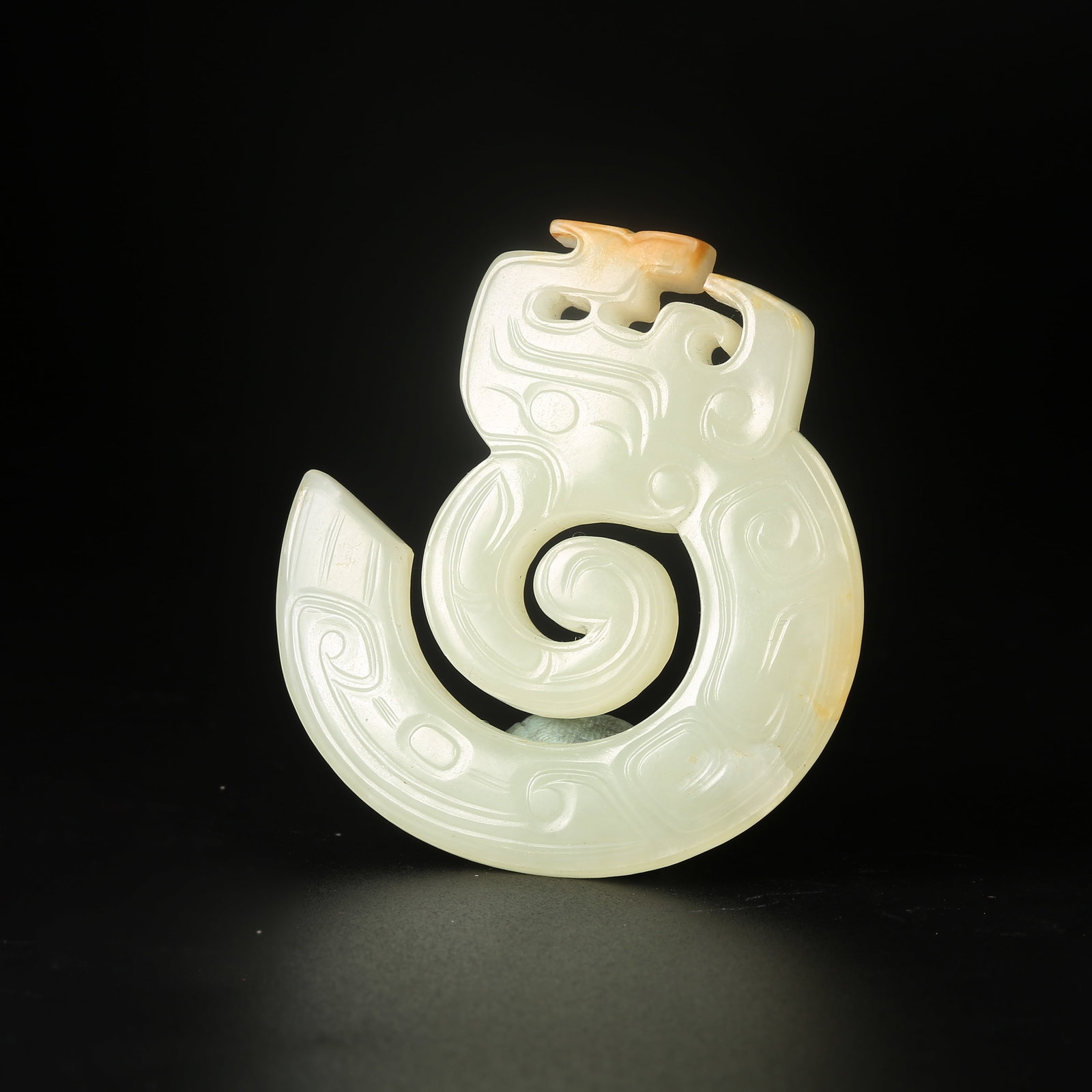 A ARCHAIC JADE DRAGON-MOTIF PENDANT (1 of 8)