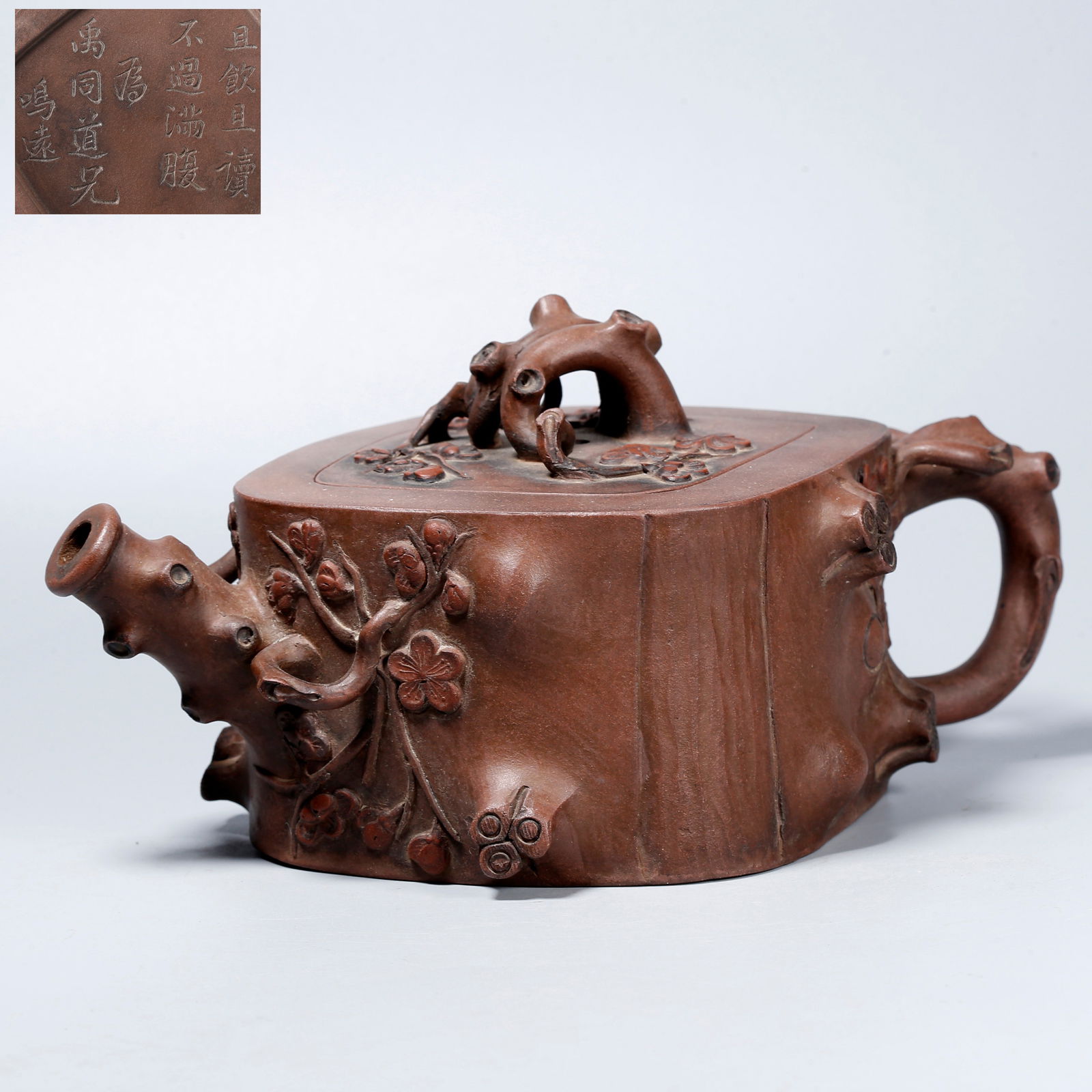 A ZISHA EWER WITH CARVED PLUM BLOSSOM DESIGN: Zisha Ewer with Carved Plum Blossom Design