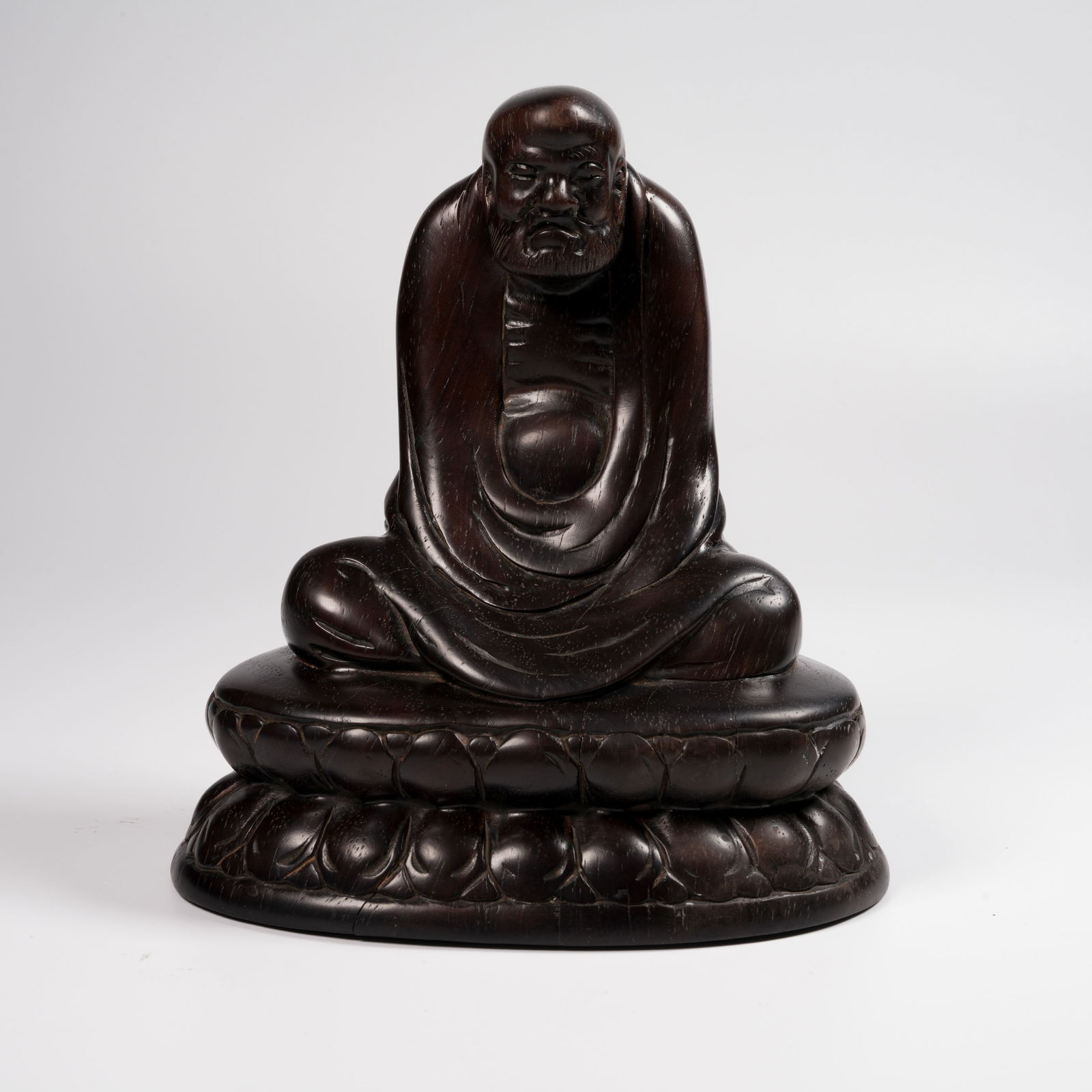 A ZITAN WOOD SEATED BODHIDHARMA FIGURE (1 of 8)
