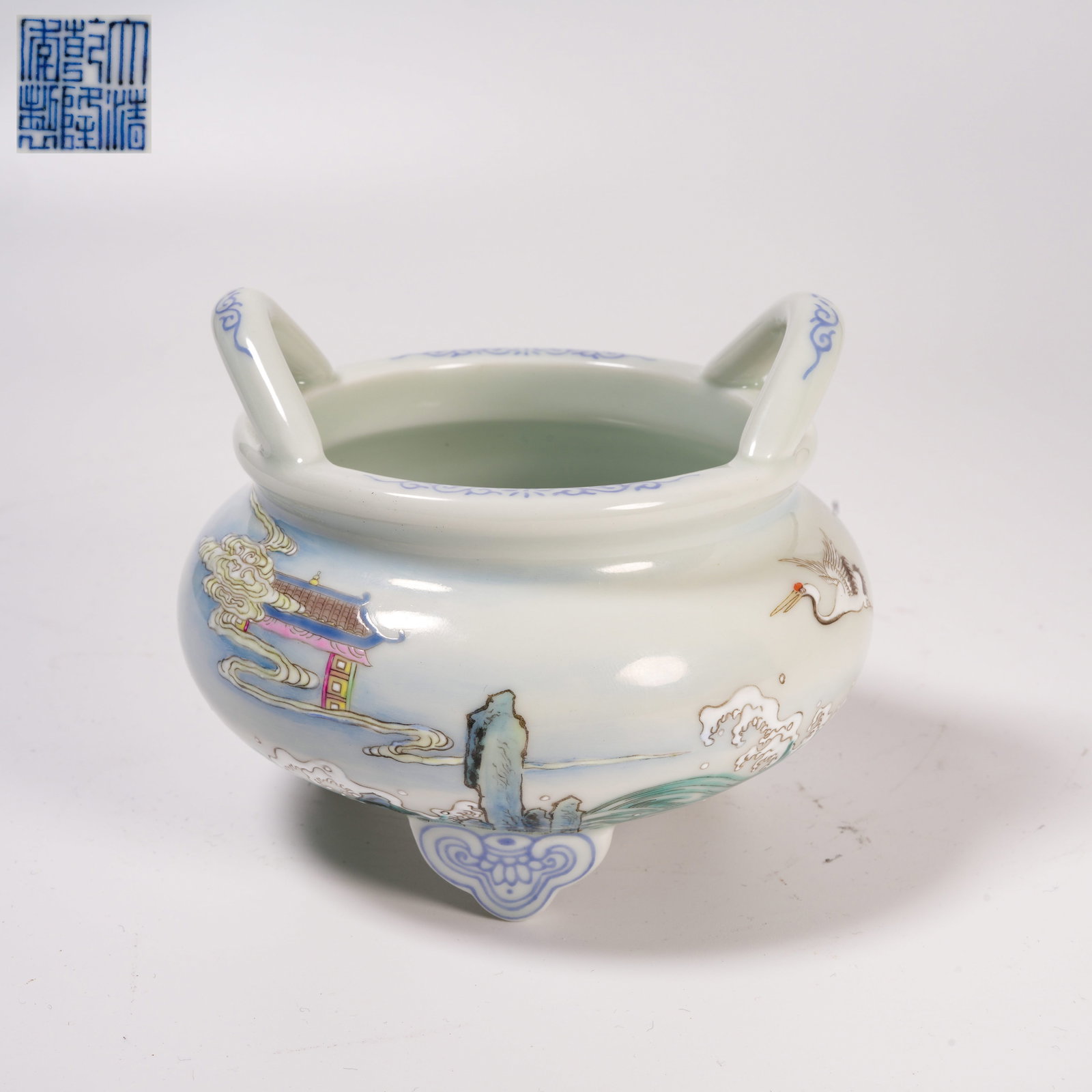 A FAMILLE-ROSE TRIPOD CENSER WITH "MOUNTAINS OF BLESSING AND SEAS OF LONGEVITY" DESIGN: Famille-Rose Tripod Censer with "Mountains of Blessing and Seas of Longevity" Design