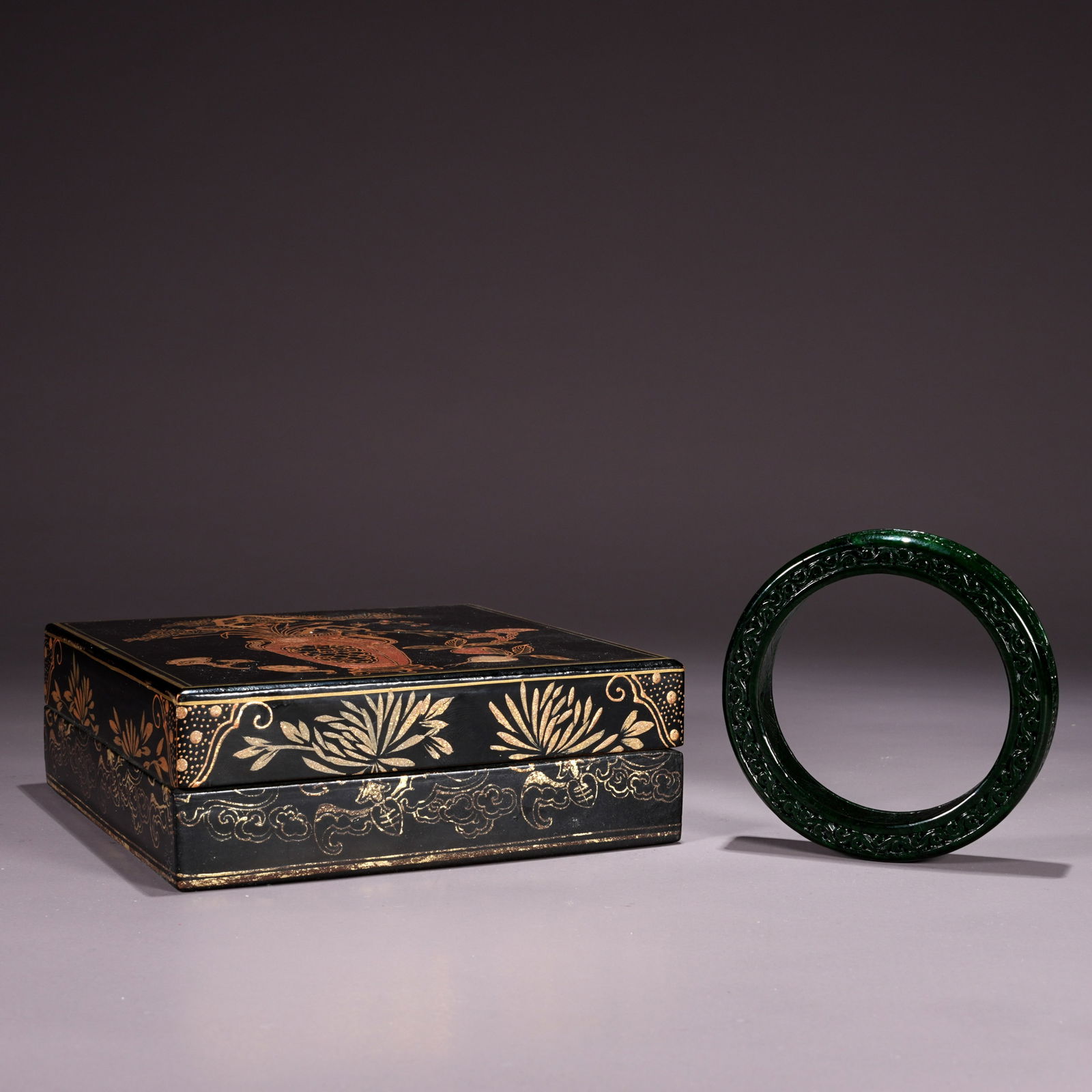 A KYANITE JADE BANGLE CARVED WITH FLOWER MOTIFS (1 of 9)
