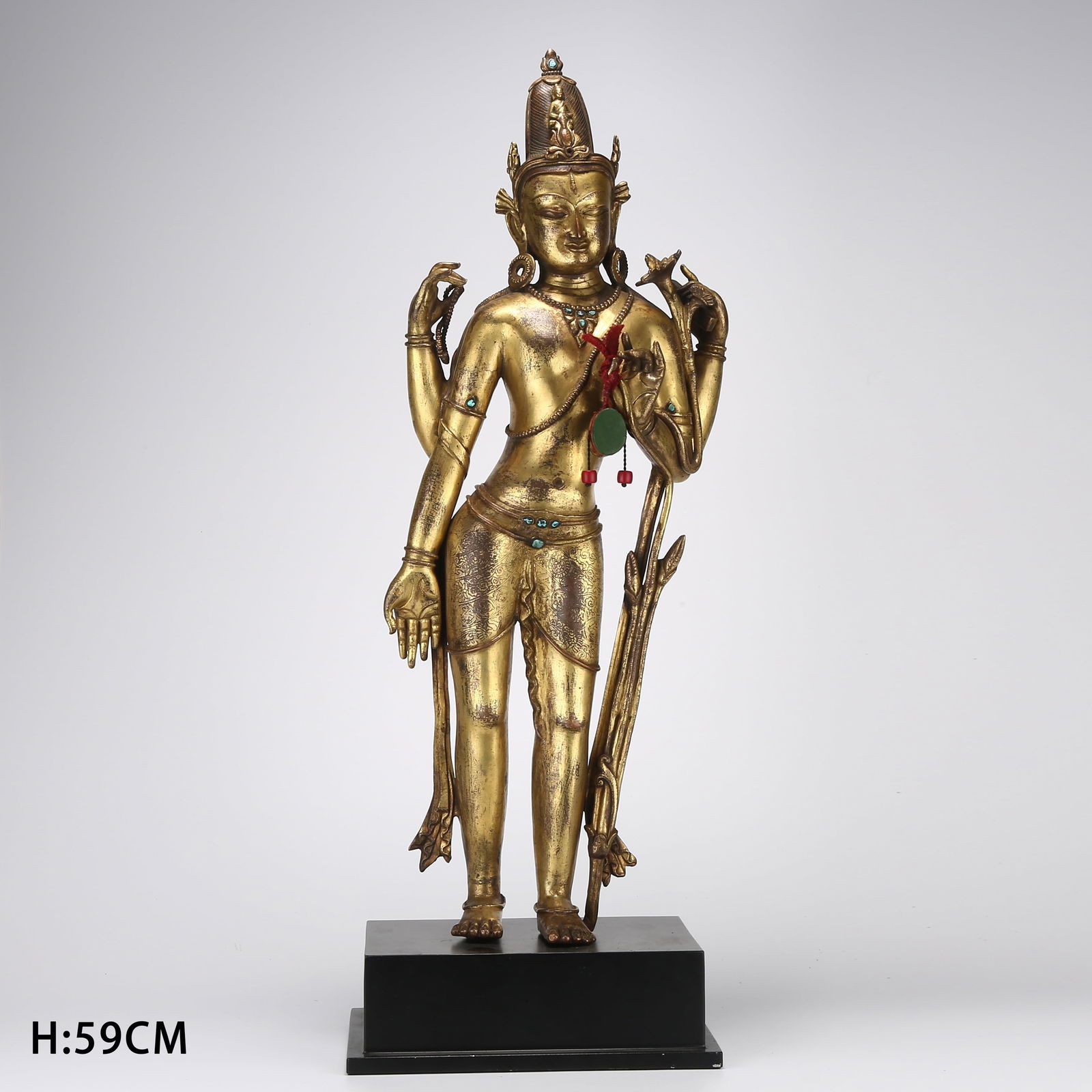 A GILDED BRONZE STANDING STATUE OF FOUR-ARMED AVALOKITESHVARA: Gilded bronze standing statue of four-armed Avalokiteshvara