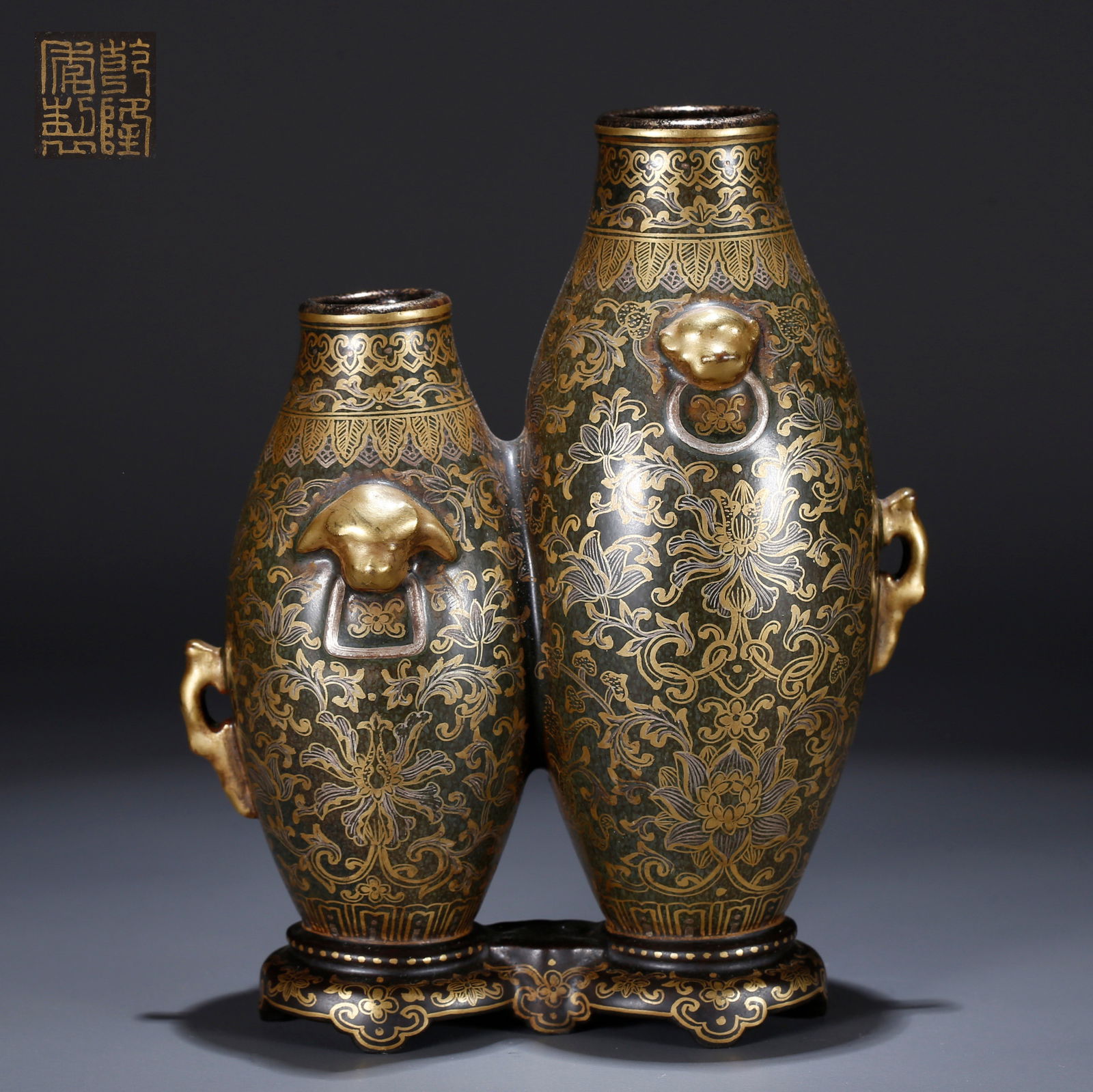 A BLACK-GROUND GILT-DECORATED DOUBLE GOURD VASE: Black-ground gilt-decorated double gourd vase