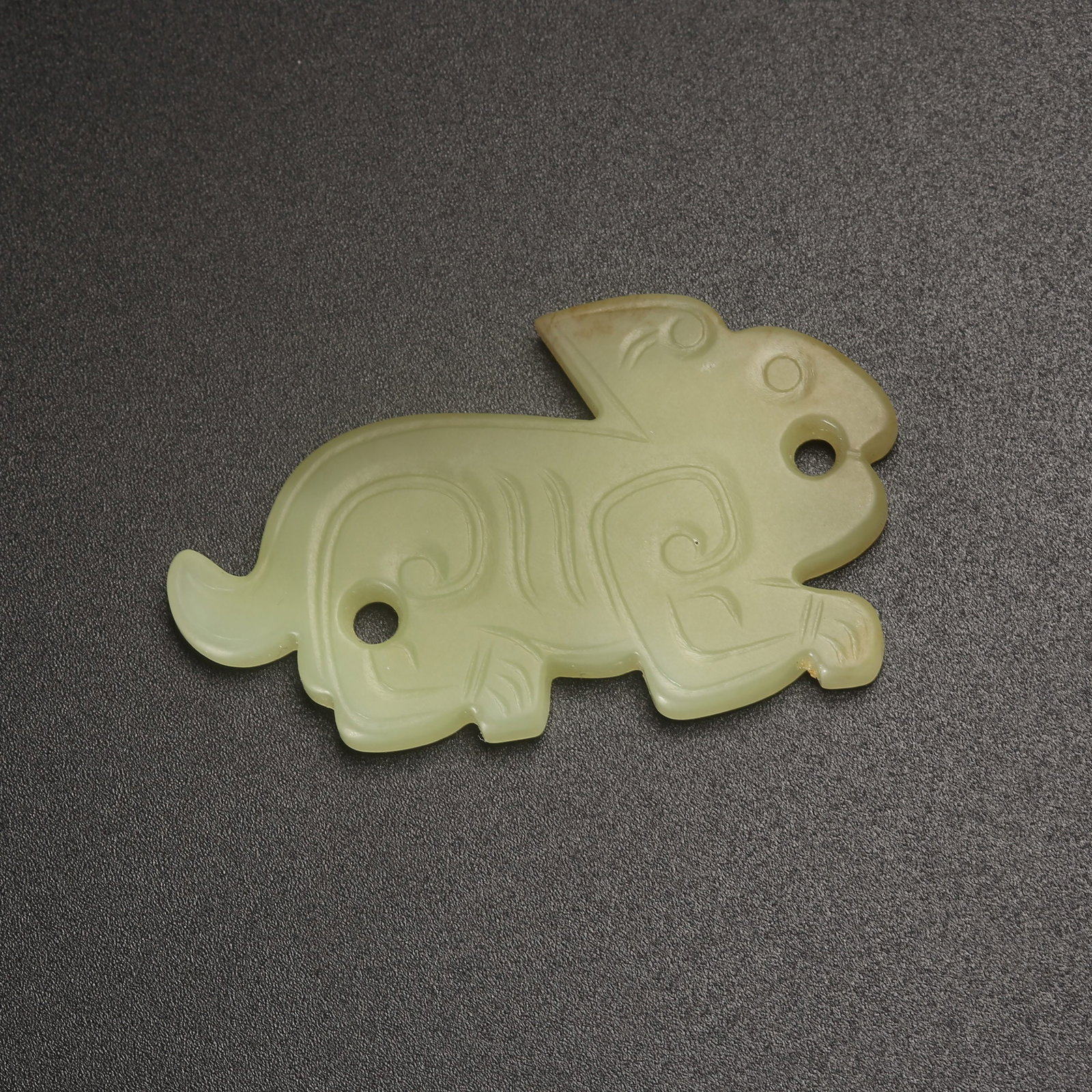 A ARCHAIC JADE AUSPICIOUS BEAST PENDANT: Archaic Jade Auspicious Beast Pendant