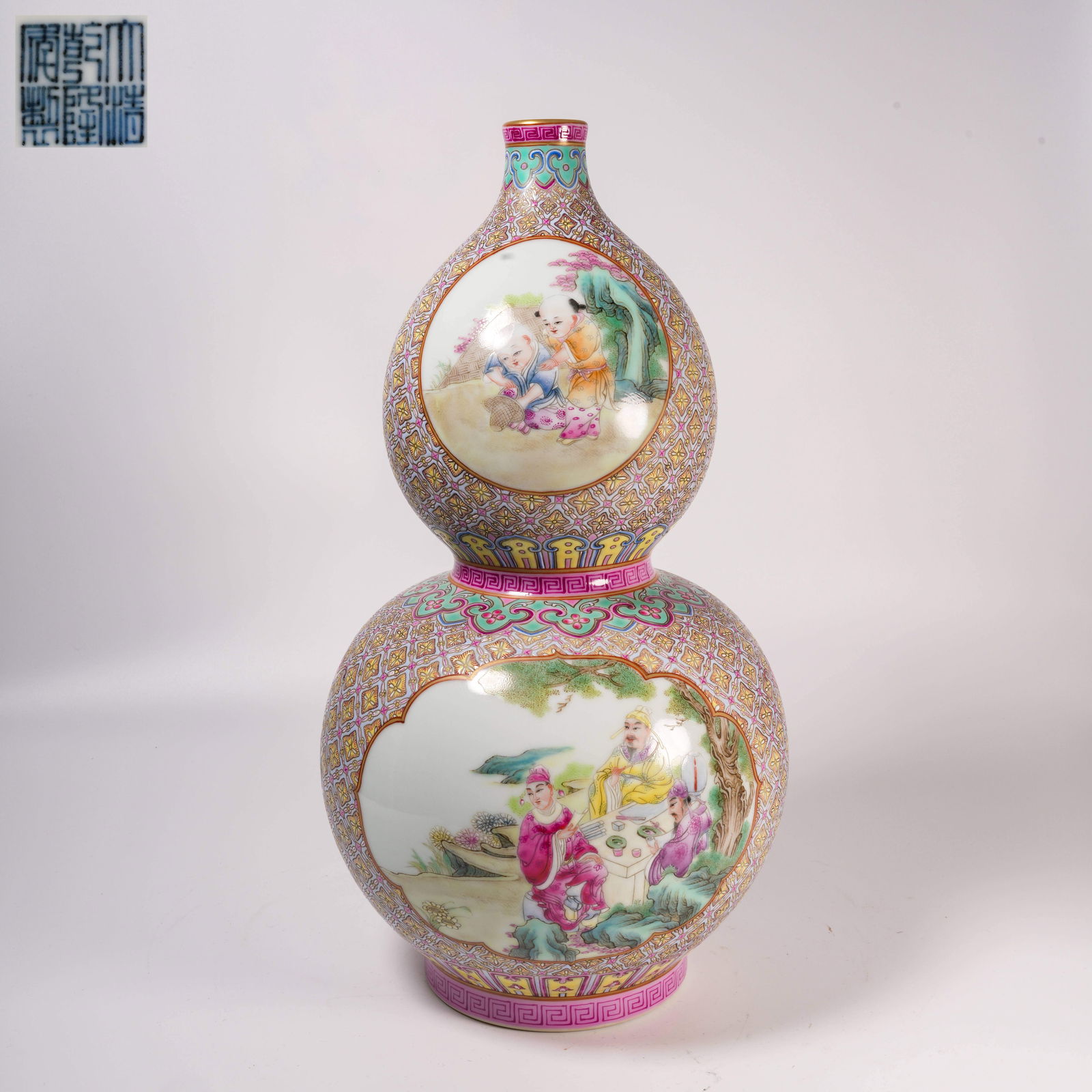 A FAMILLE-ROSE GOURD-SHAPED VASE WITH INCISED-GROUND CARTOUCHES AND FIGURAL STORY SCENES (1 of 9)