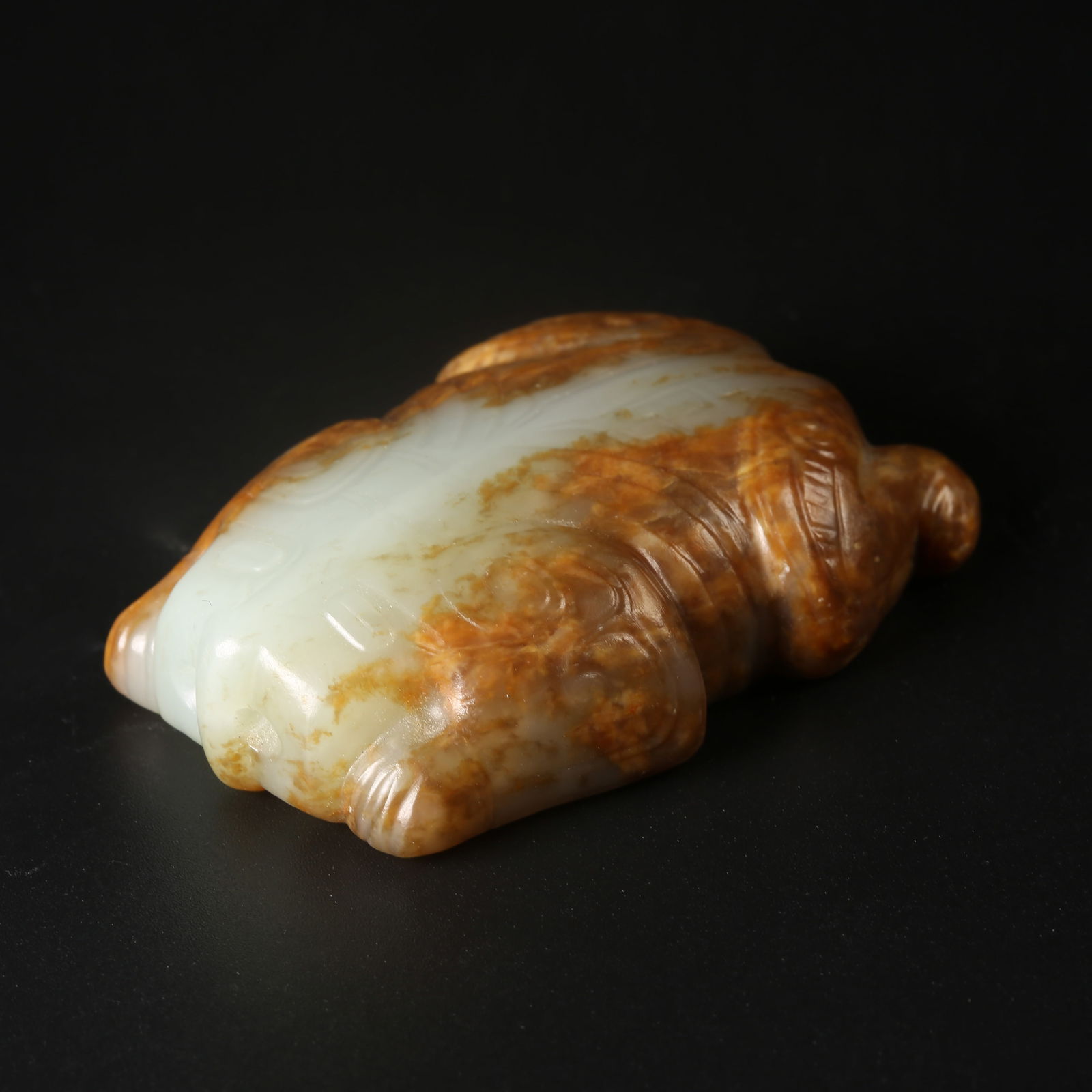 A ARCHAIC JADE RECUMBENT RAM PENDANT: Archaic Jade Recumbent Ram Pendant