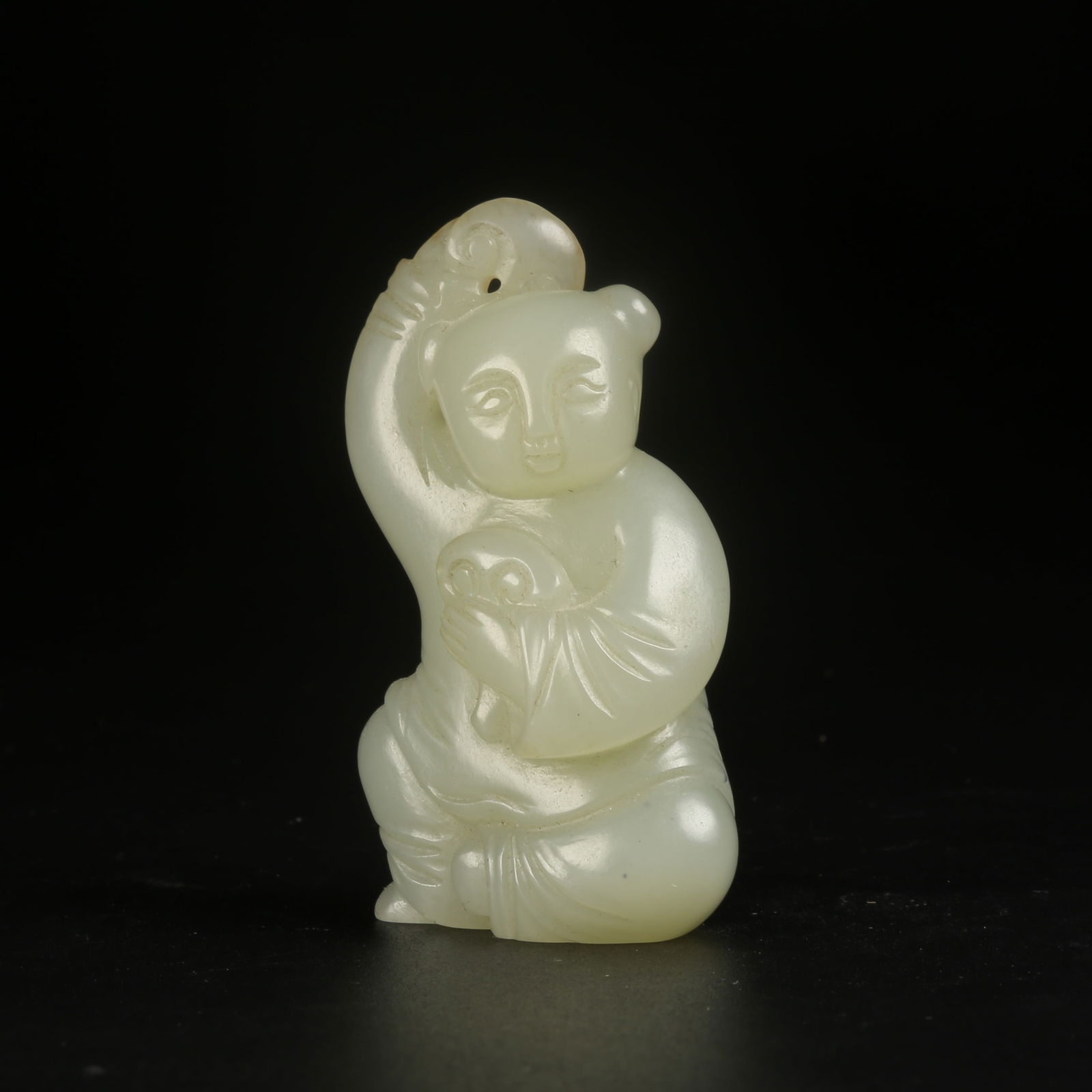 A HETIAN JADE LINGZHI CHILD PENDANT (1 of 8)