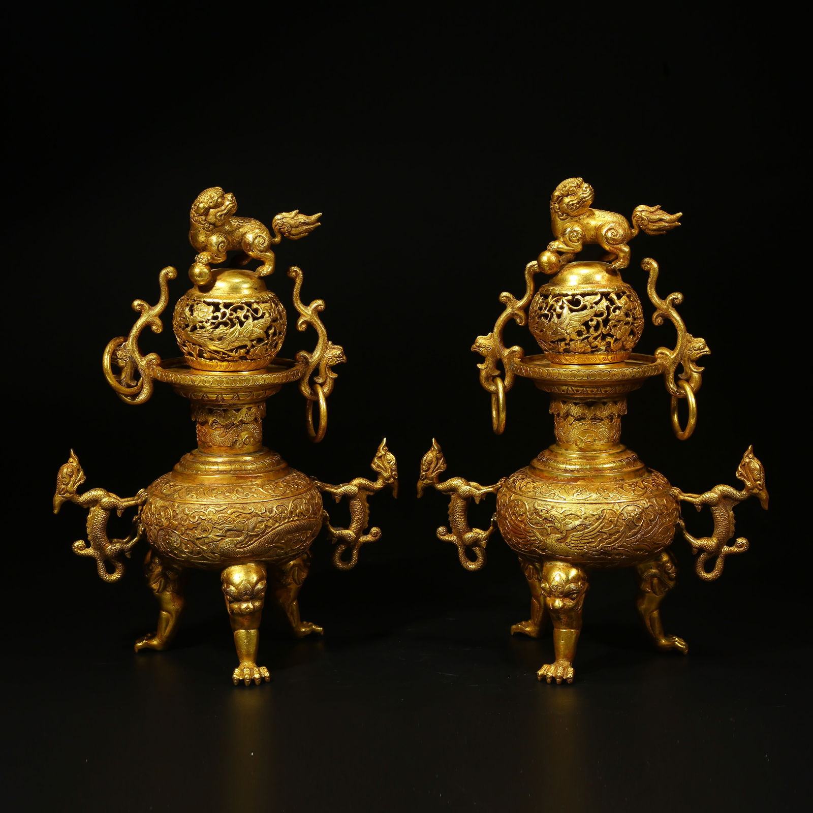 A GILT BRONZE INCENSE BURNER WITH DRAGON-AND-PHOENIX MOTIF AND LION KNOB: Gilt Bronze Incense Burner with Dragon-and-Phoenix Motif and Lion Knob