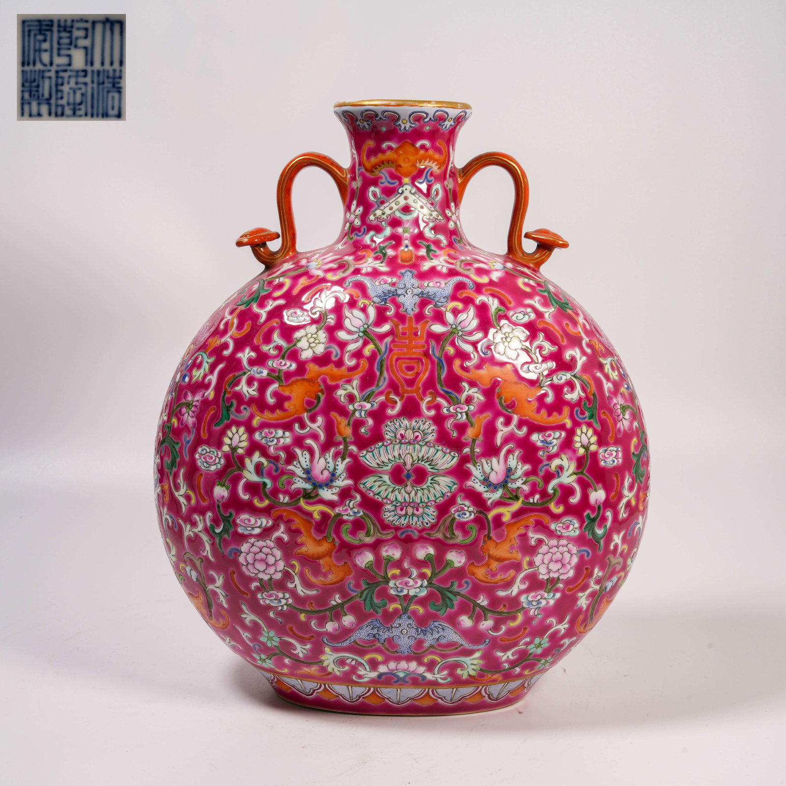 A PALACE-PINK GROUND FAMILLE-ROSE MOON-HANDLED VASE WITH INTERTWINING FLORAL SCROLLS: Palace-Pink Ground Famille-Rose Moon-Handled Vase with Intertwining Floral Scrolls