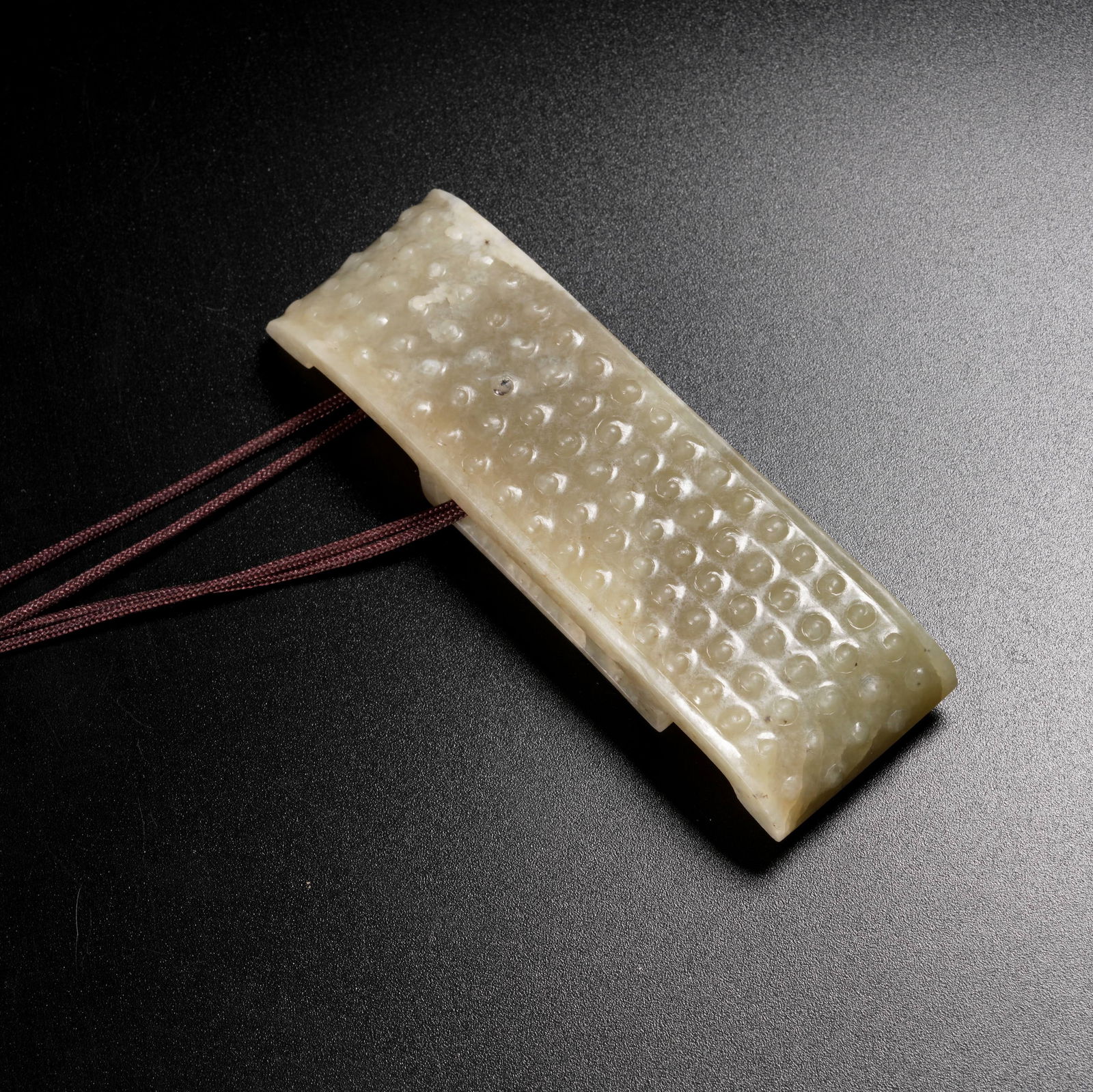 A ARCHAIC JADE SWORD CHAPE (1 of 10)