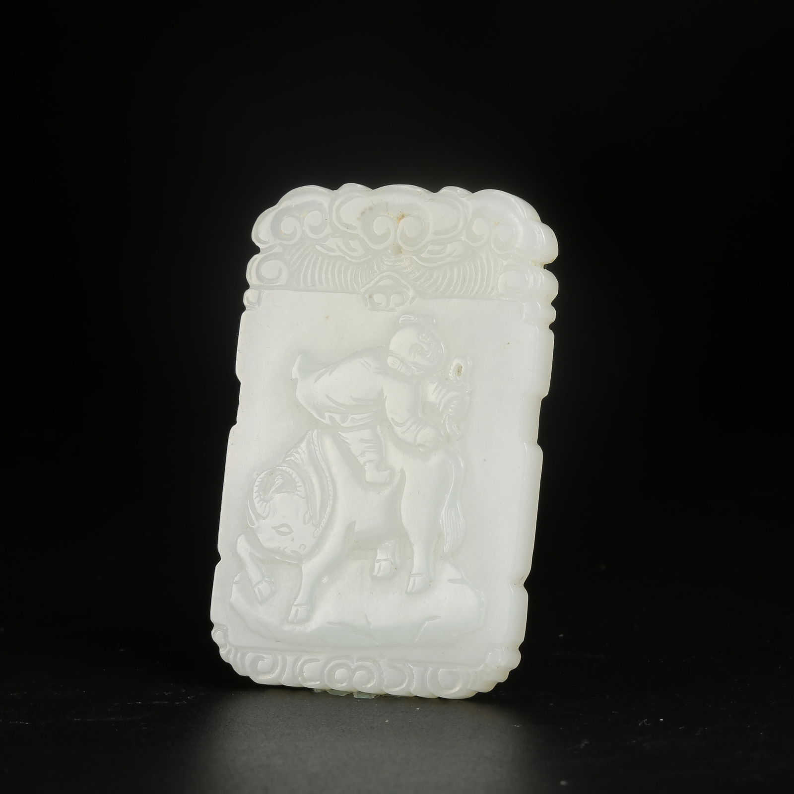 A HETIAN JADE CHILD PLAYING WITH OX PLAQUE: Hetian Jade Child Playing with Ox Plaque