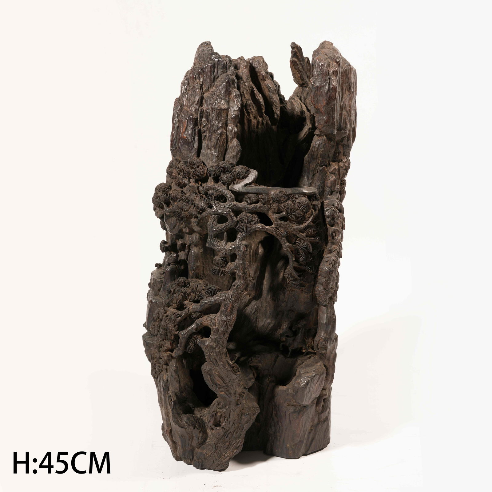 A ZITAN CARVED SCHOLAR'S ROCK SCULPTURE DEPICTING A SCHOLAR BENEATH PINE TREES: Zitan Carved Scholar's Rock Sculpture Depicting a Scholar beneath Pine Trees