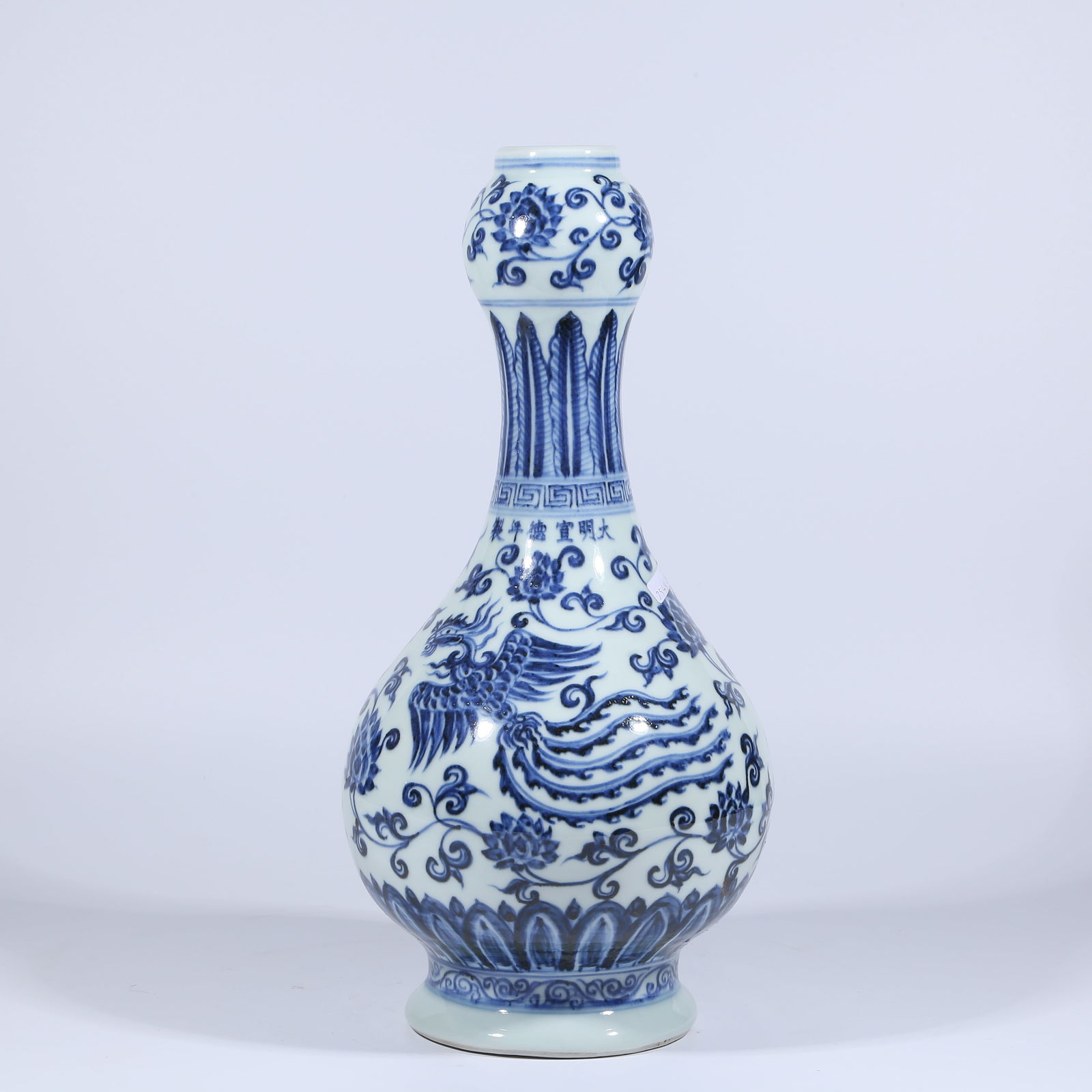 A BLUE AND WHITE GARLIC-MOUTH VASE WITH PHOENIX AMONG FLOWERS DESIGN: Blue and White Garlic-mouth Vase with Phoenix among Flowers Design