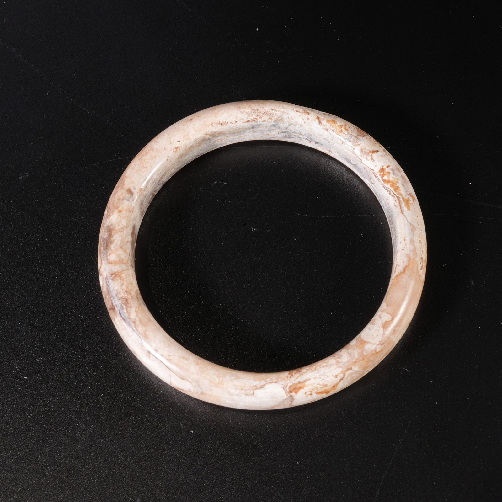 A ARCHAIC JADE CARVED BANGLE: Archaic jade carved bangle