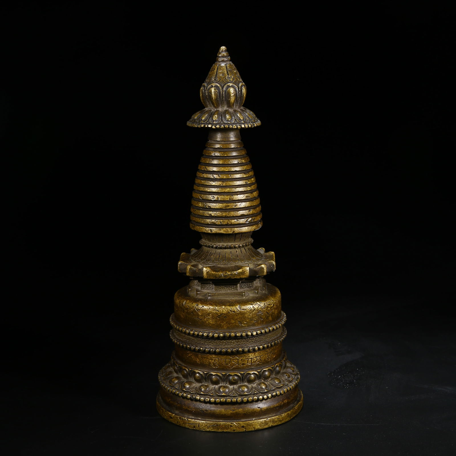 A BRONZE KADAM STUPA: Bronze Kadam stupa