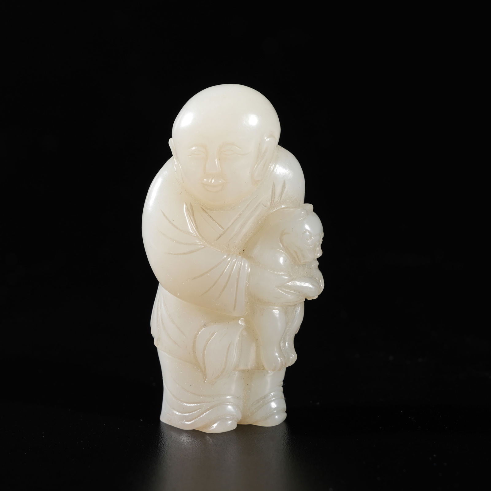 A HETIAN JADE CARVED BOY-FORM ORNAMENT (1 of 8)