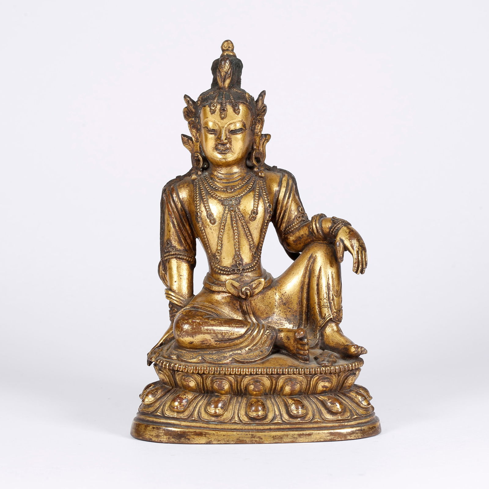 A GILT BRONZE FREE-FORM AVALOKITESHVARA STATUE: Gilt Bronze Free-Form Avalokiteshvara Statue