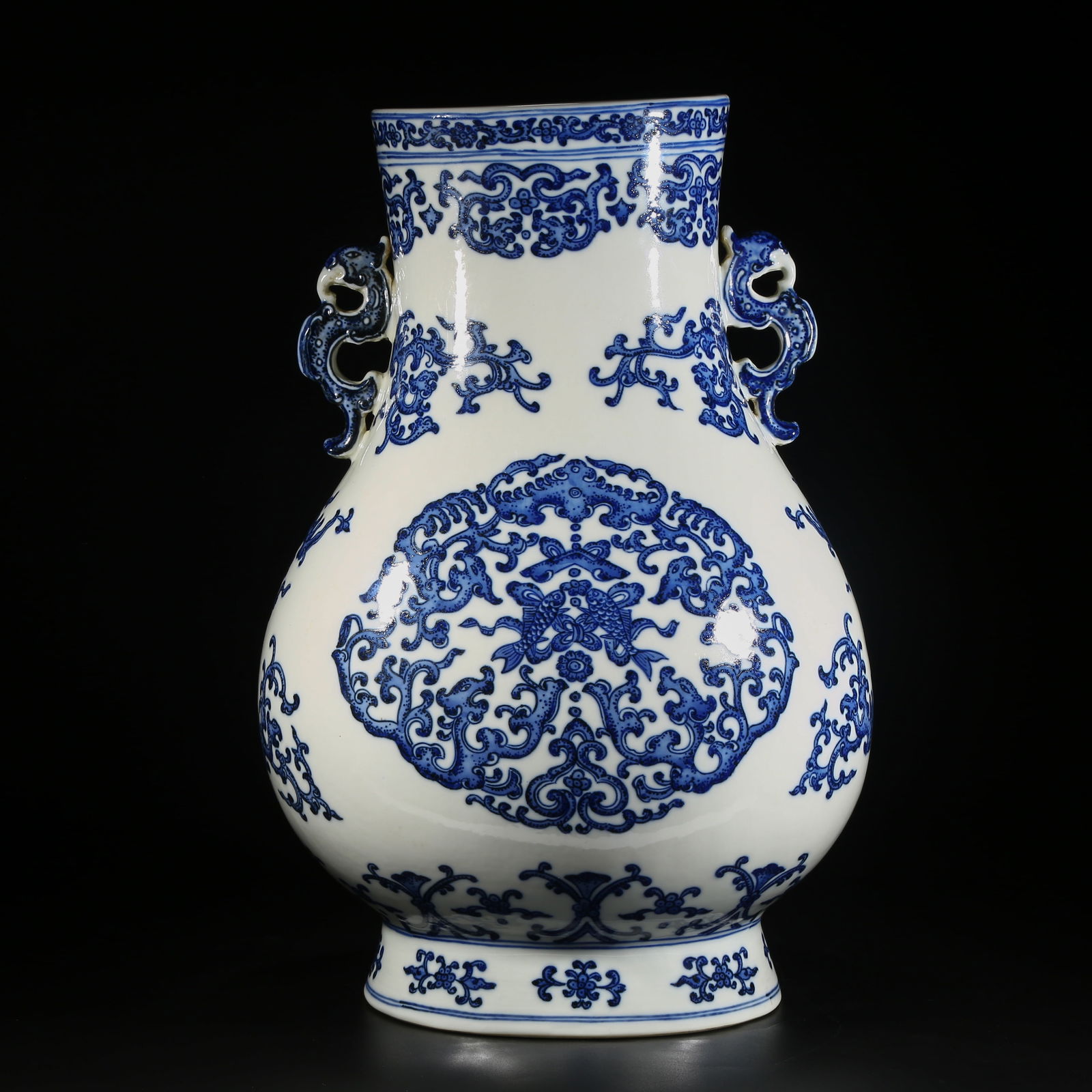 A BLUE-AND-WHITE PHOENIX-HANDLED VASE WITH "AUSPICIOUS SURPLUS" PATTERN: Blue-and-White Phoenix-Handled Vase with "Auspicious Surplus" Pattern