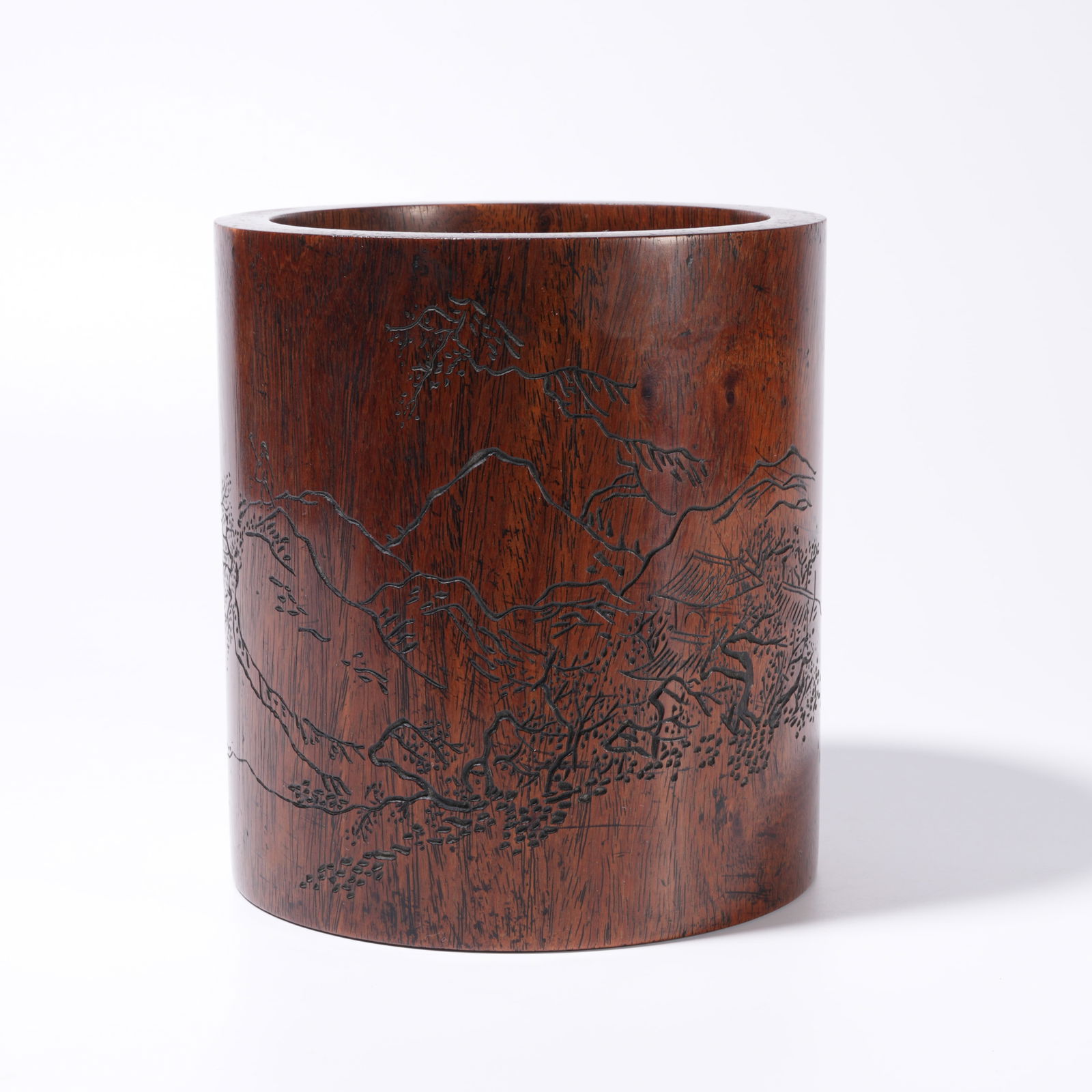 A HUANGHUALI WOOD CARVING LANDSCAPE-PATTERN BRUSH HOLDER: Huanghuali Wood Carving Landscape-Pattern Brush Holder