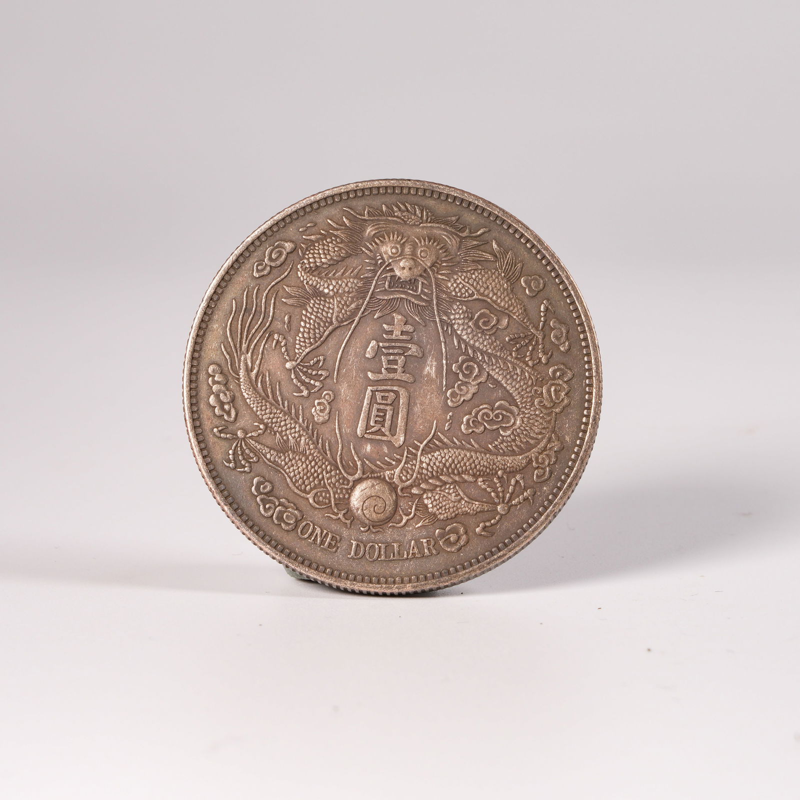 A SILVER DOLLAR COIN - 3