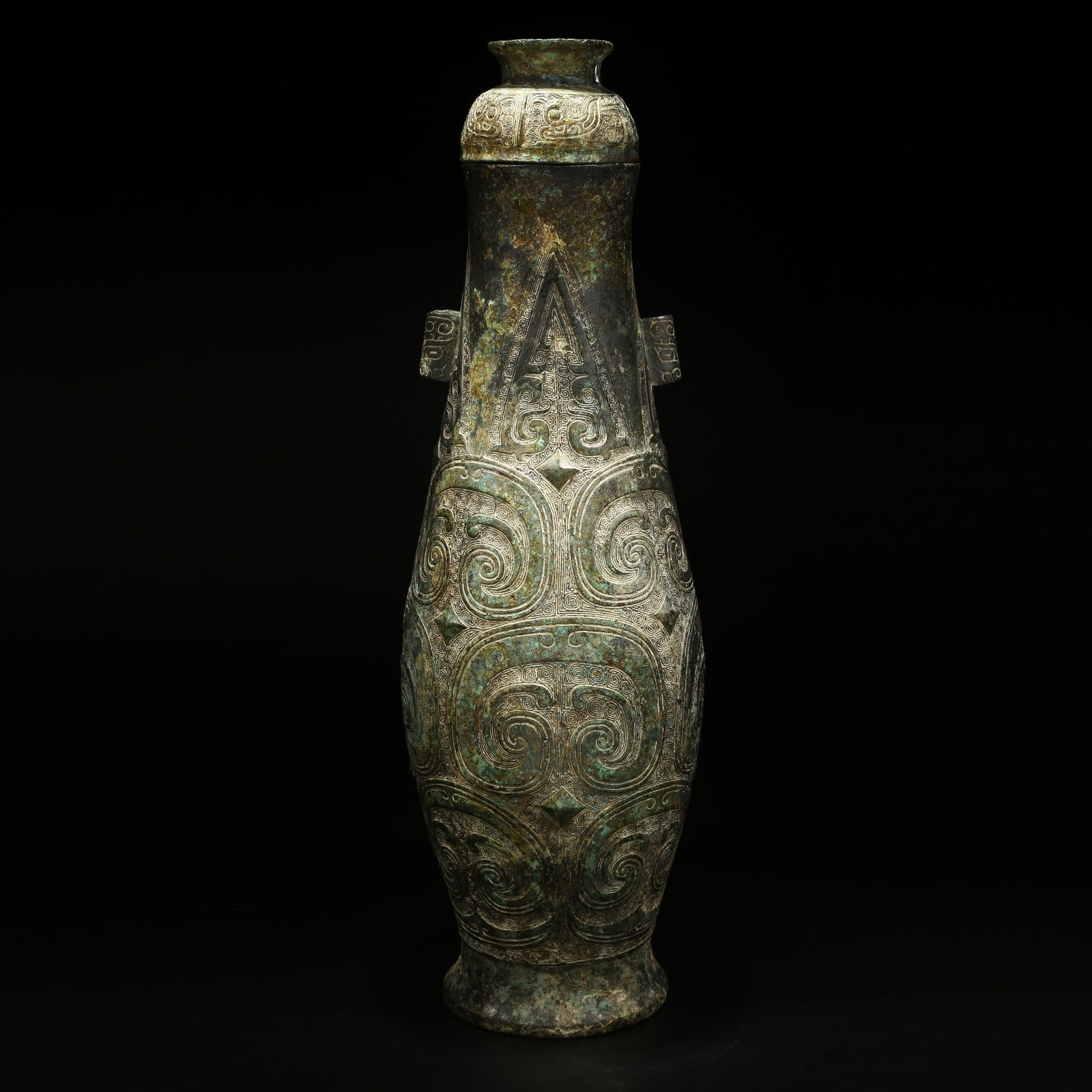 A BRONZE VASE WITH CLOUD-AND-THUNDER PATTERN AND LOOPED EARS: Bronze vase with cloud-and-thunder pattern and looped ears