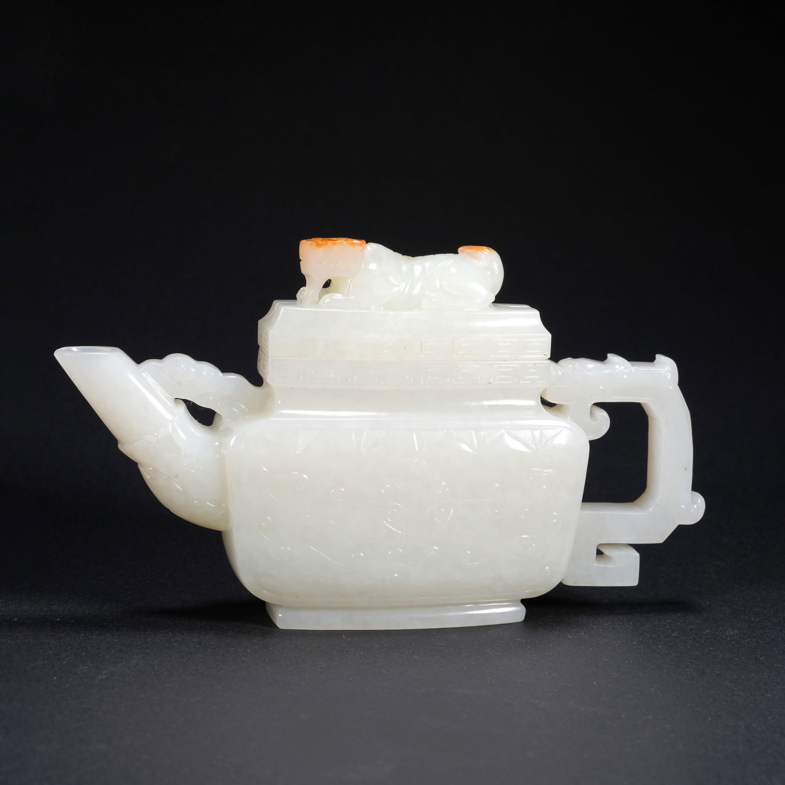 A HETIAN JADE CARVED EWER WITH LION FINIAL AND BEAST-MASK DECORATION: Hetian Jade Carved Ewer with Lion Finial and Beast-Mask Decoration