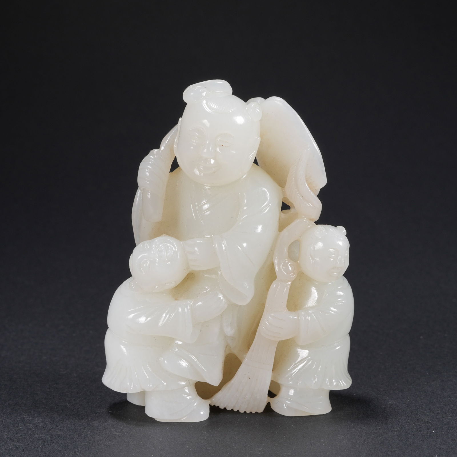 A HETIAN JADE CARVED THREE BOYS ANNOUNCING HAPPINESS FIGURE: Hetian Jade Carved Three Boys Announcing Happiness Figure