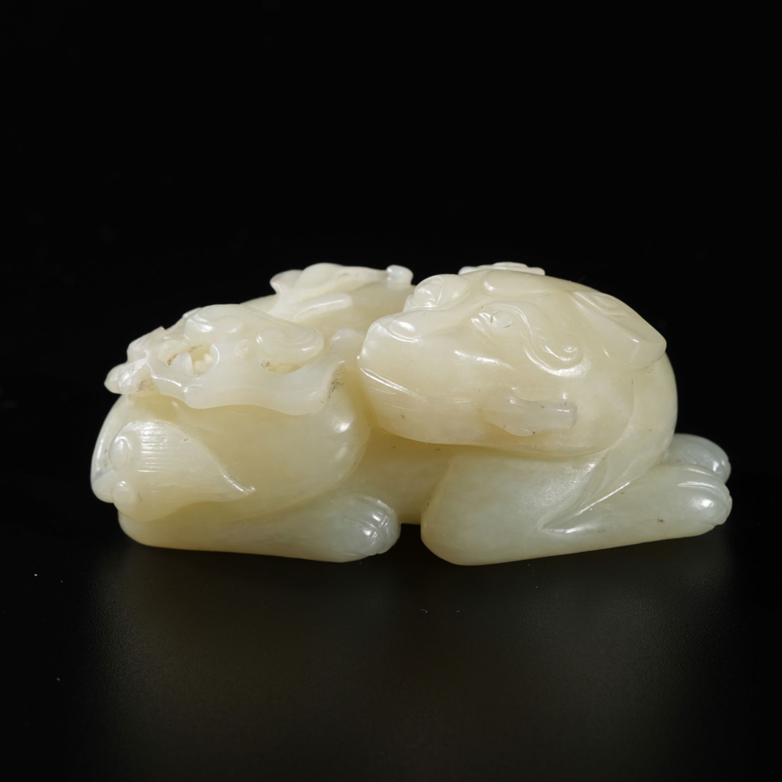 A HETIAN JADE CARVED BEAST-FORM ORNAMENT (1 of 10)