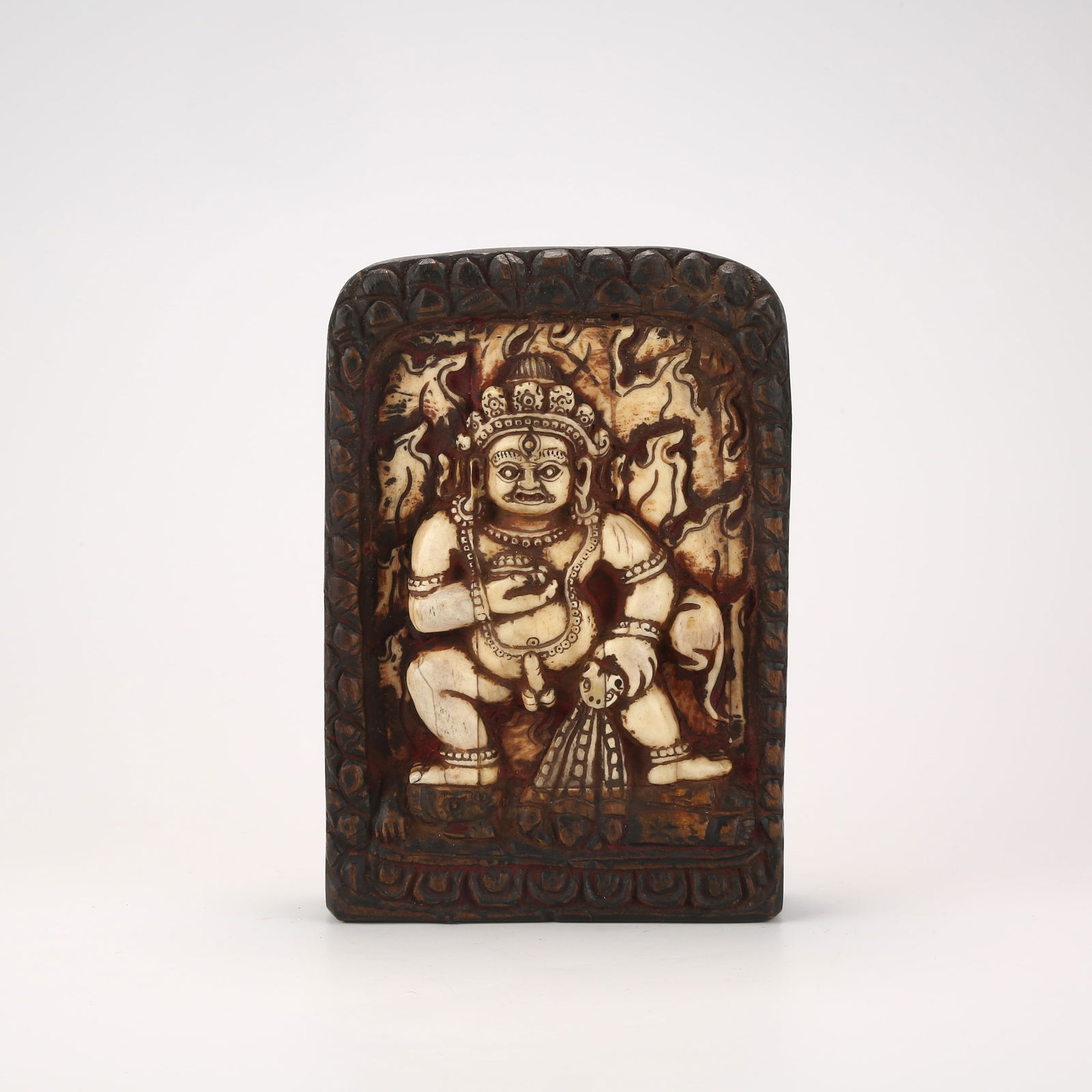 A BLACK JAMBHALA FIGURE IN ROSEWOOD WITH INLAID BONE CARVING: Black Jambhala Figure in Rosewood with Inlaid Bone Carving