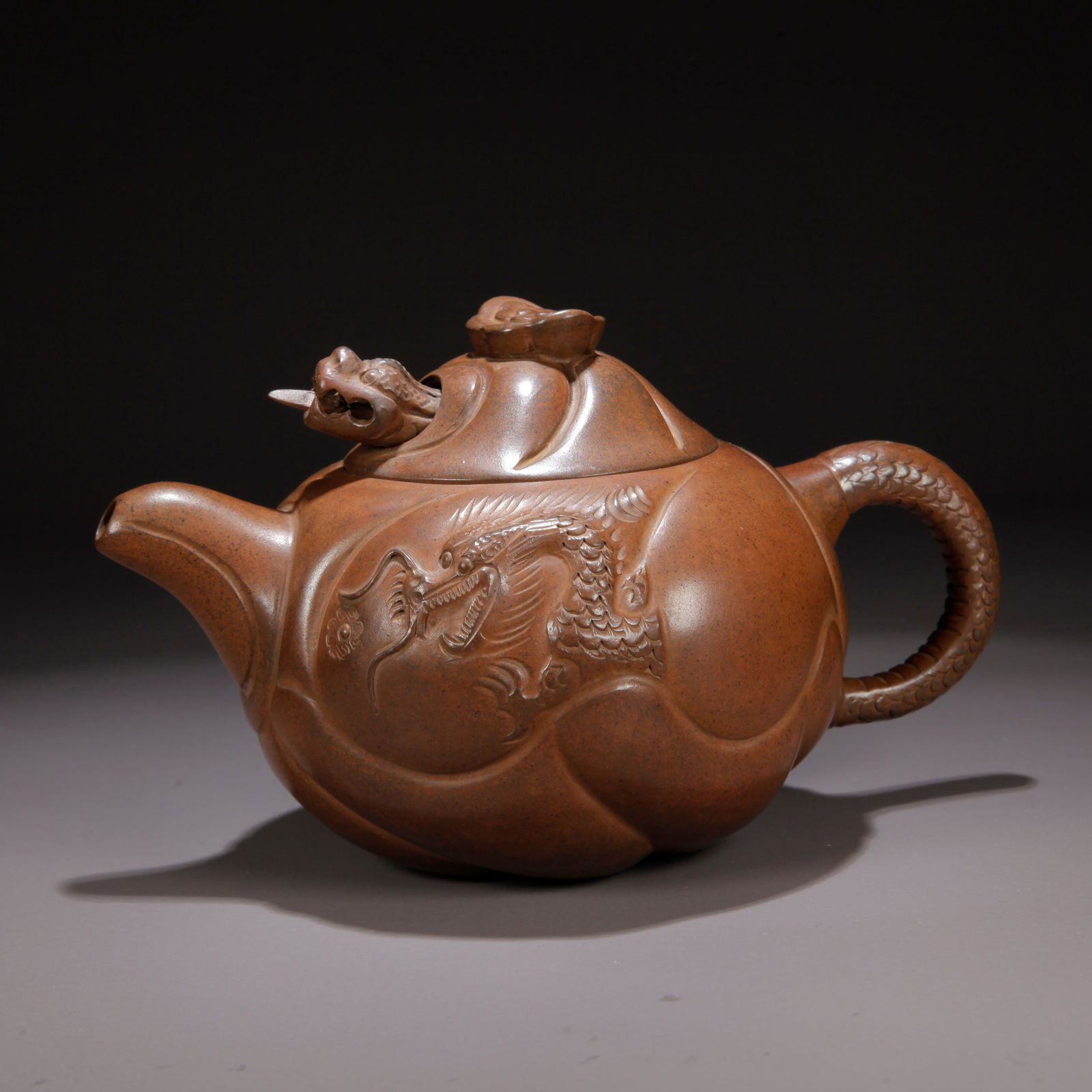 A ZISHA CLAY FISH-TO-DRAGON PATTERN EWER: Zisha Clay Fish-to-Dragon Pattern Ewer