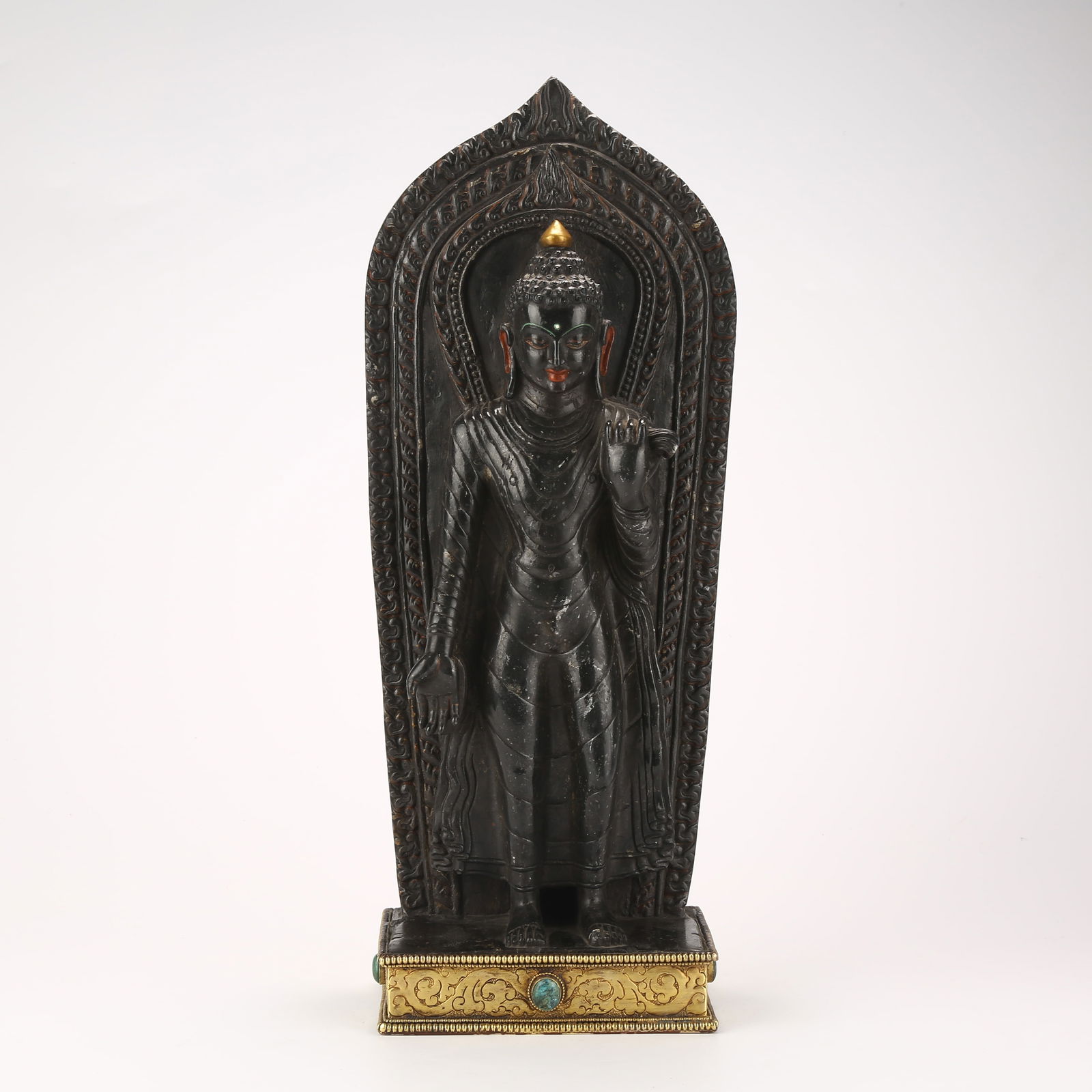 A STANDING SHAKYAMUNI FIGURE IN BLACK STONE (1 of 9)