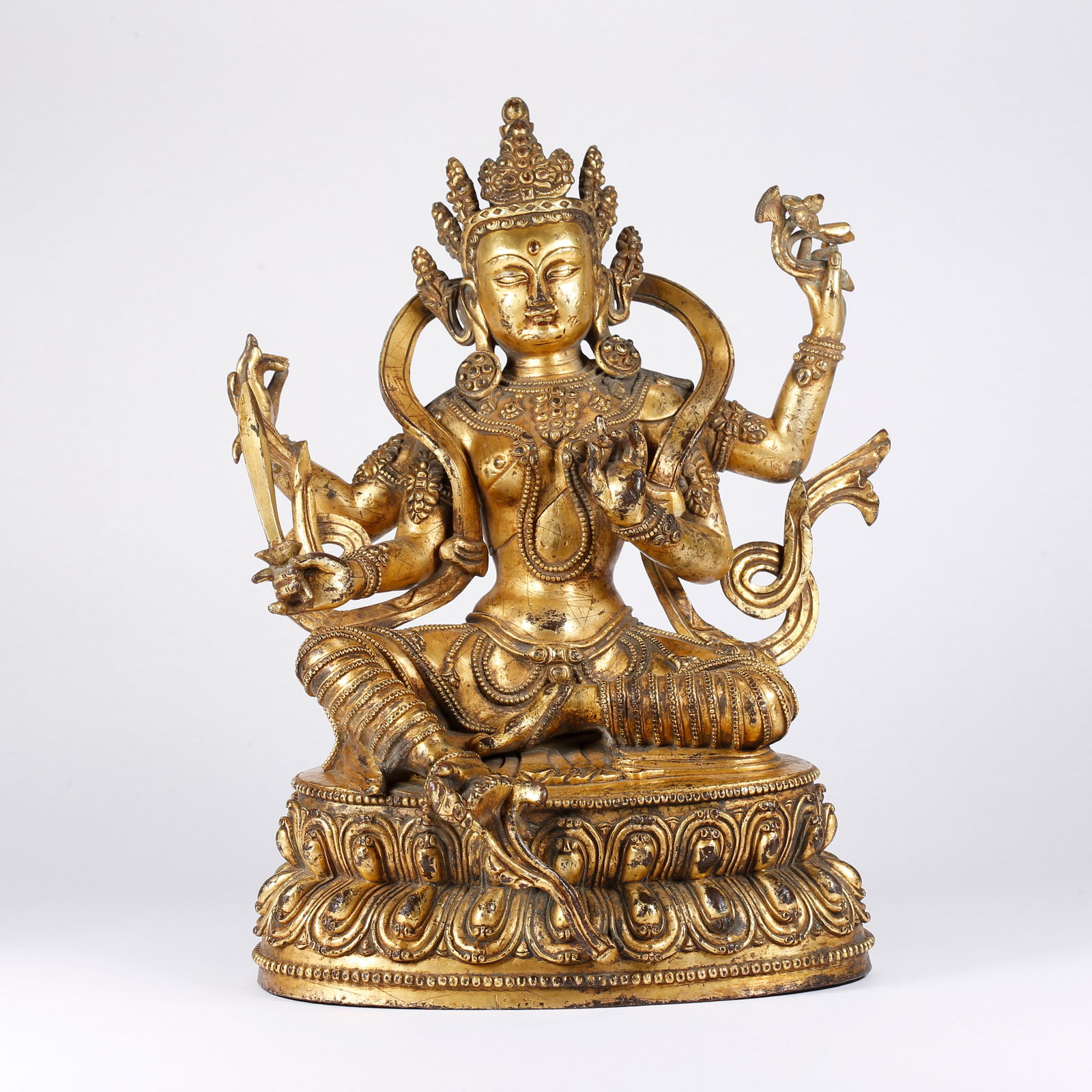 A GILT BRONZE SIX-ARMED VAJRAVARAHI (1 of 9)