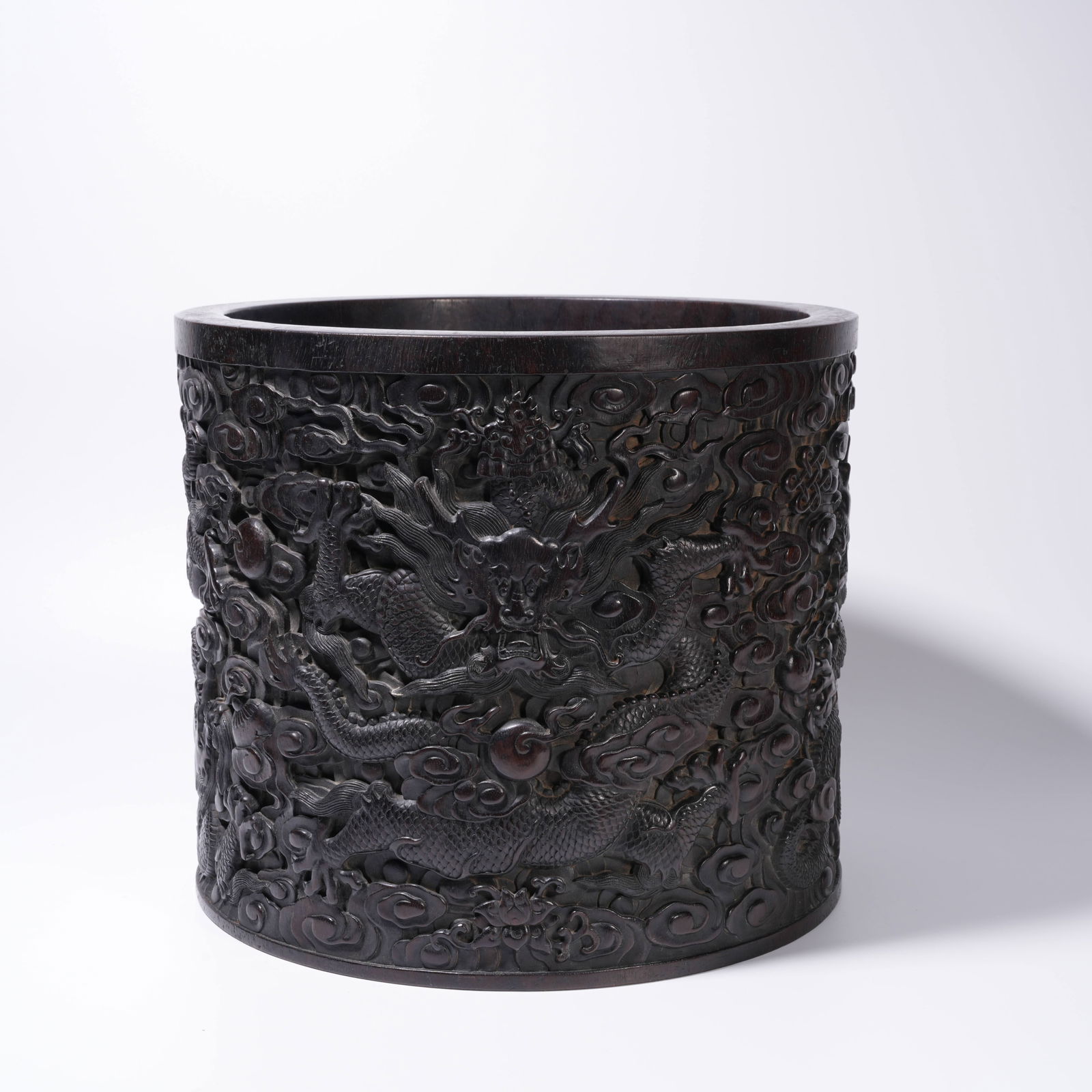 A ZITAN WOOD CARVING CLOUD AND DRAGON-PATTERN BRUSH HOLDER: Zitan Wood Carving Cloud and Dragon-Pattern Brush Holder