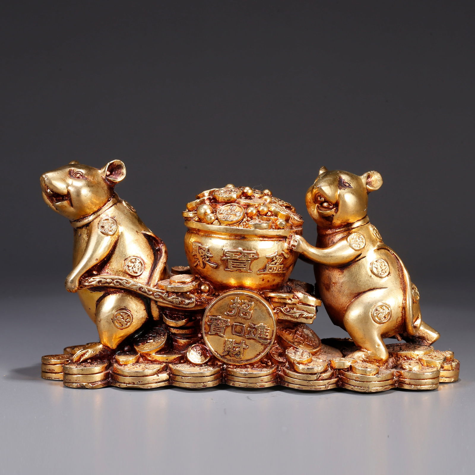 A GILT BRONZE WEALTH-BRINGING RAT-SHAPED ORNAMENT: Gilt bronze wealth-bringing rat-shaped ornament