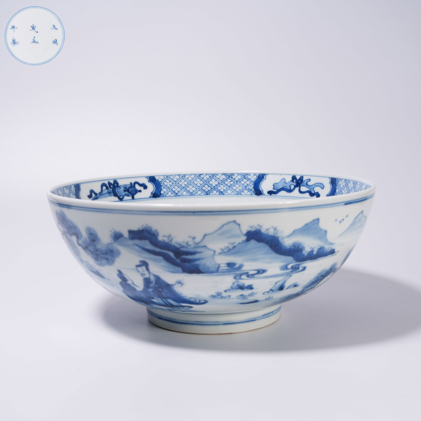 A LARGE BLUE-AND-WHITE BOWL WITH LANDSCAPE AND FIGURE DESIGN: Large blue-and-white bowl with landscape and figure design