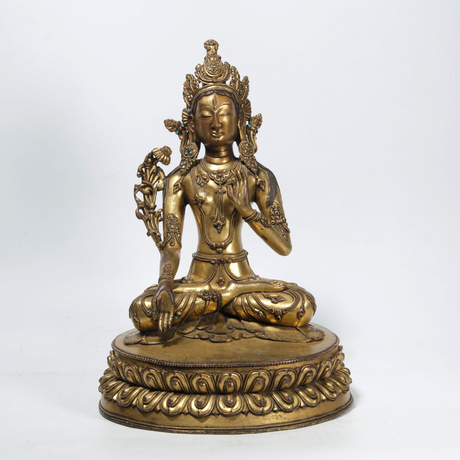 A GILT BRONZE LOTUS-HOLDING GUANYIN STATUE: Gilt Bronze Lotus-holding Guanyin Statue