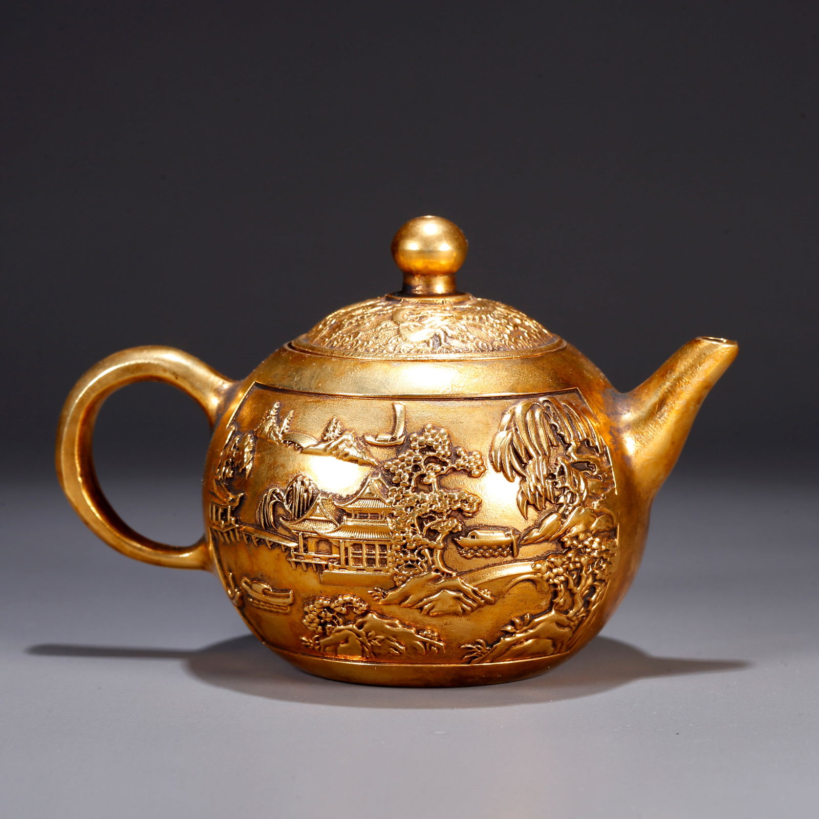 A GILT BRONZE EWER WITH LANDSCAPE AND PAVILION DESIGN (1 of 9)