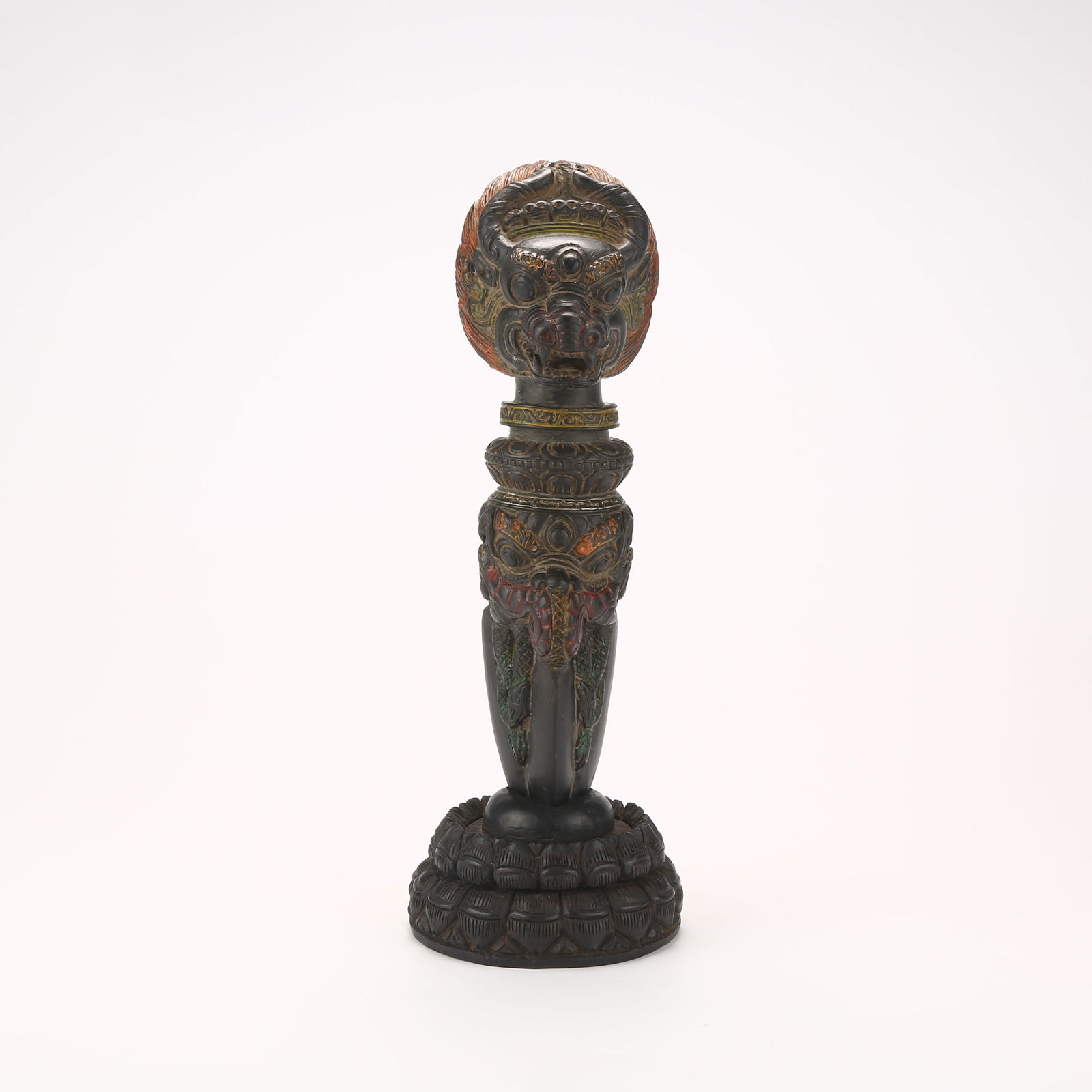 A POLYCHROME VAJRABHAIRAVA CHOPPER RITUAL OBJECT IN BLACK STONE: Polychrome Vajrabhairava Chopper Ritual Object in Black Stone